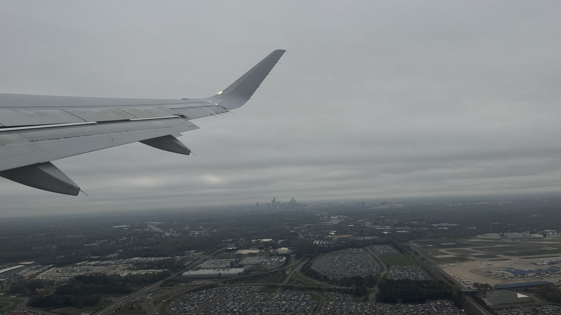 A plane flies over Uptown