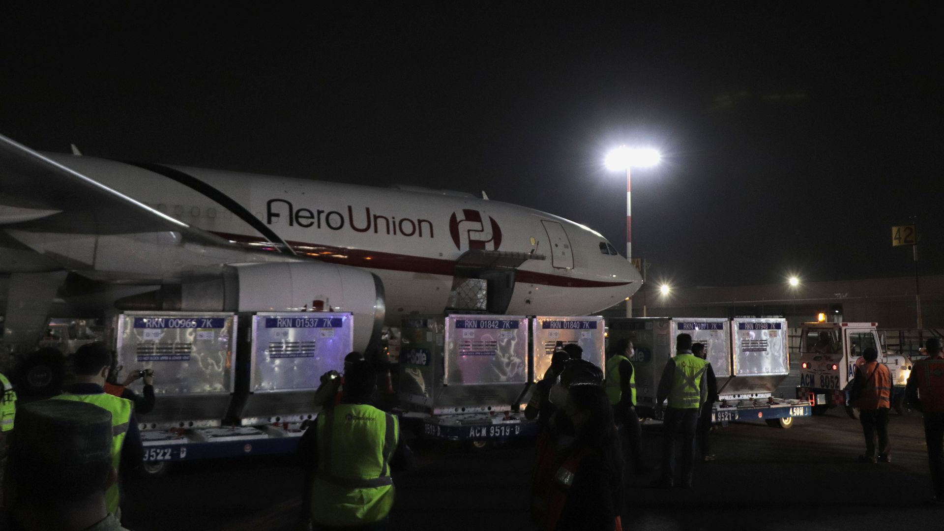 Workers at Mexico City's International Airport receiving 1.5 million AstraZeneca coronavirus vaccines from the U.S. in March 2021.