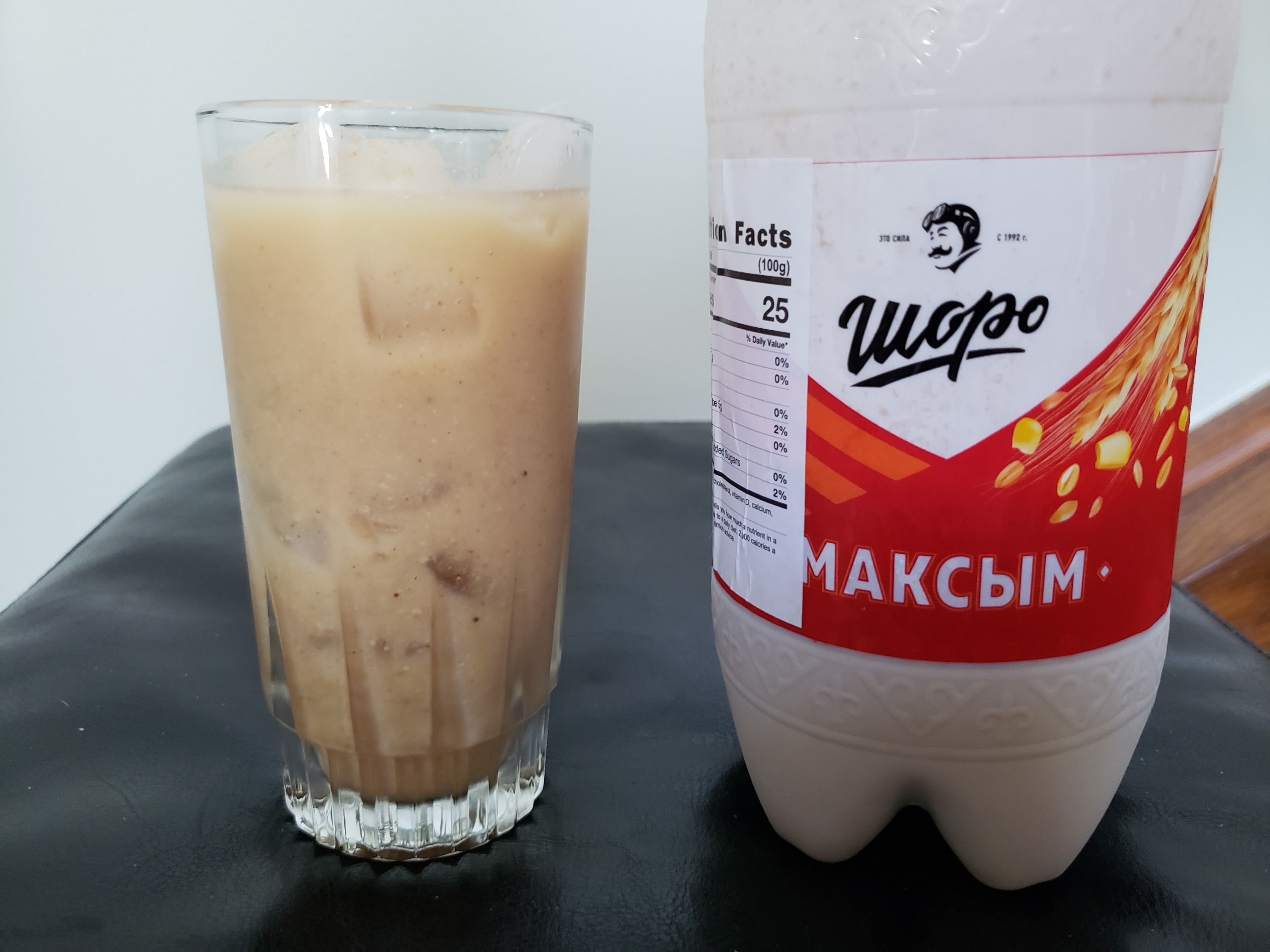 A milky jug of Maksym Shoro, next to a glass.