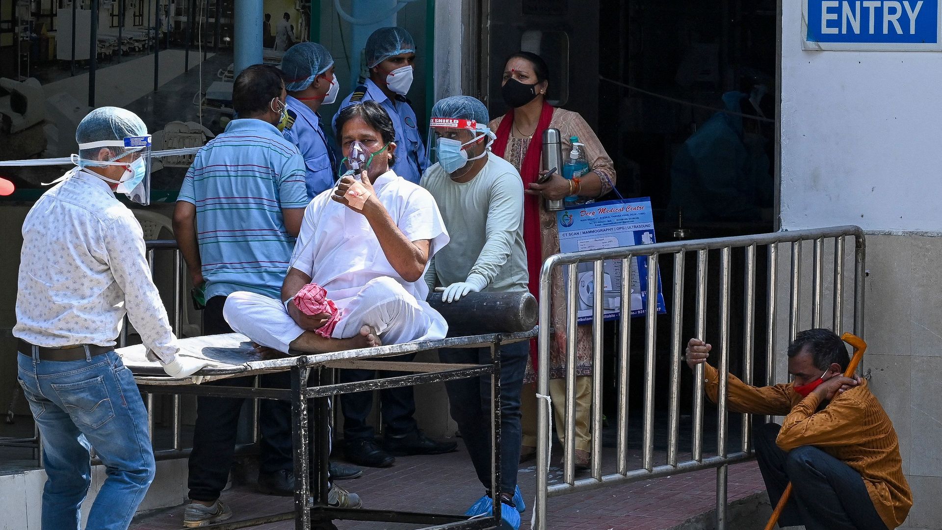 A Covid-19 coronavirus patient is shifted to ward after admission at GTB hospital in New Delhi on April 29