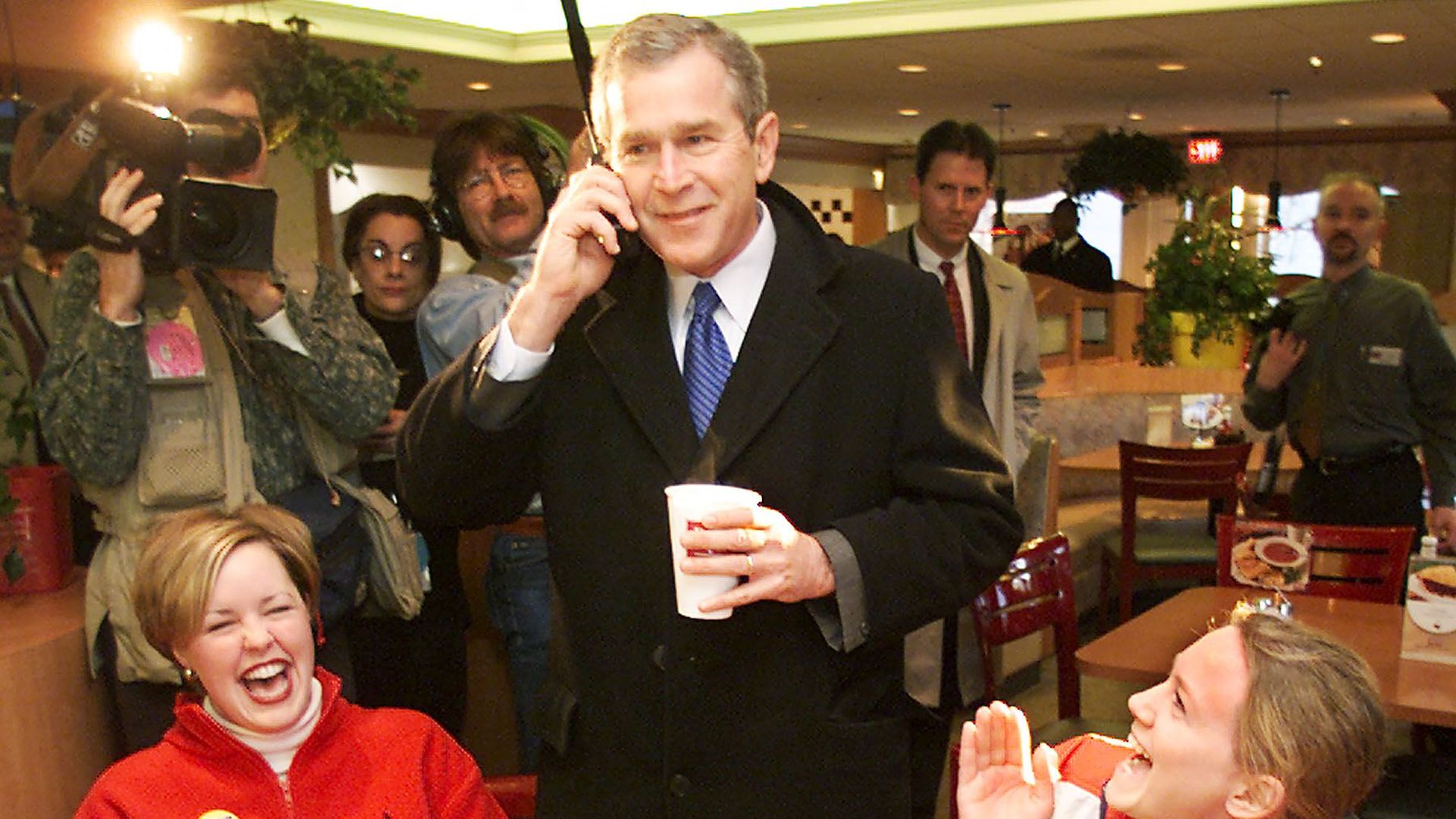 George Bush on the phone at an Iowa restaurant
