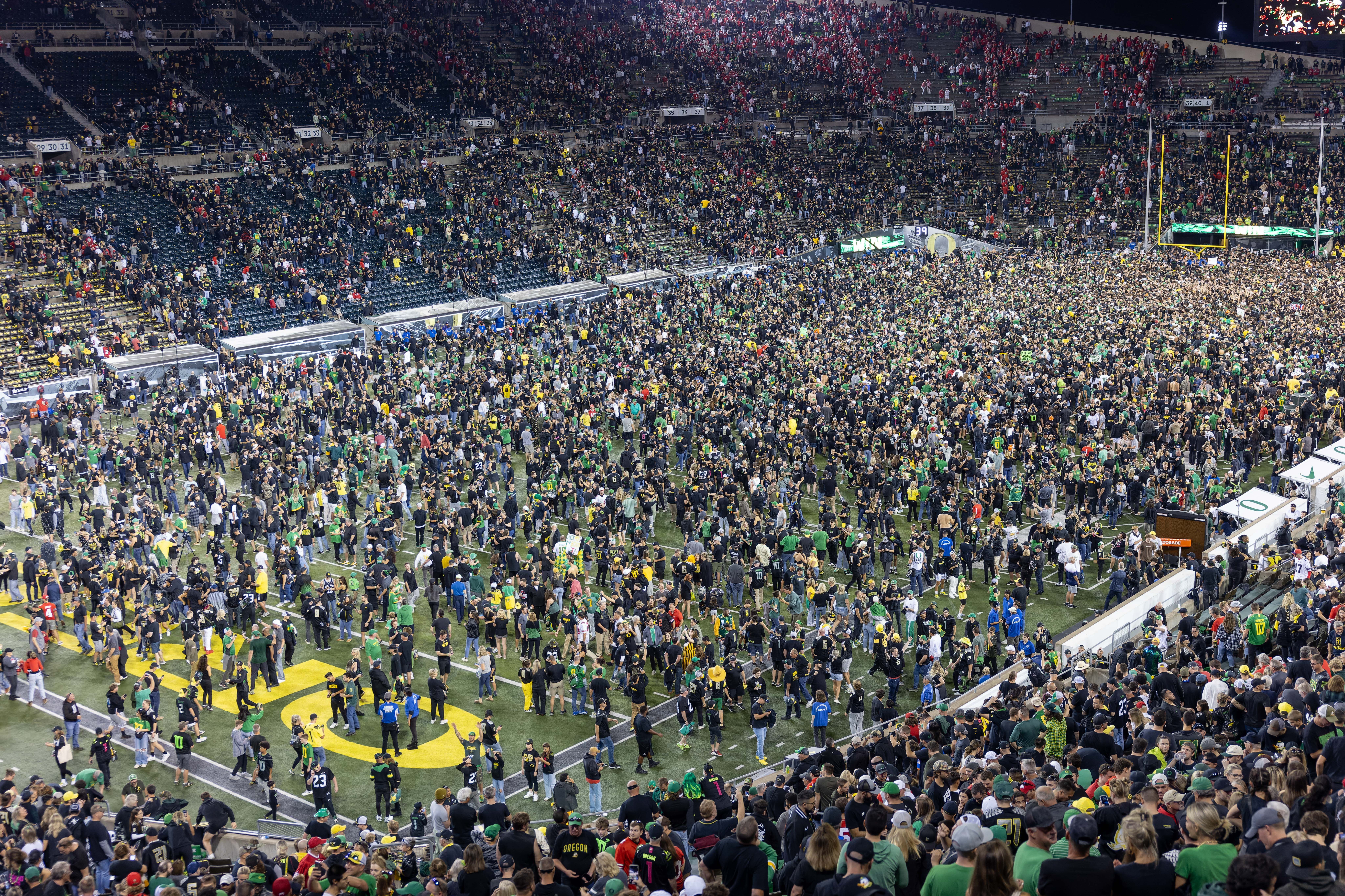 View from above of fans storming Oregon Ducks field