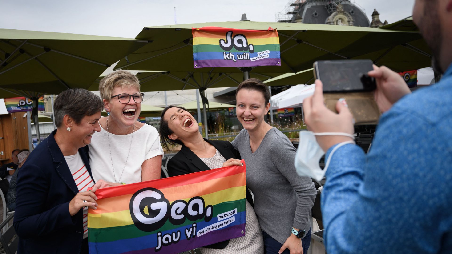 Supporters pose for a picture 