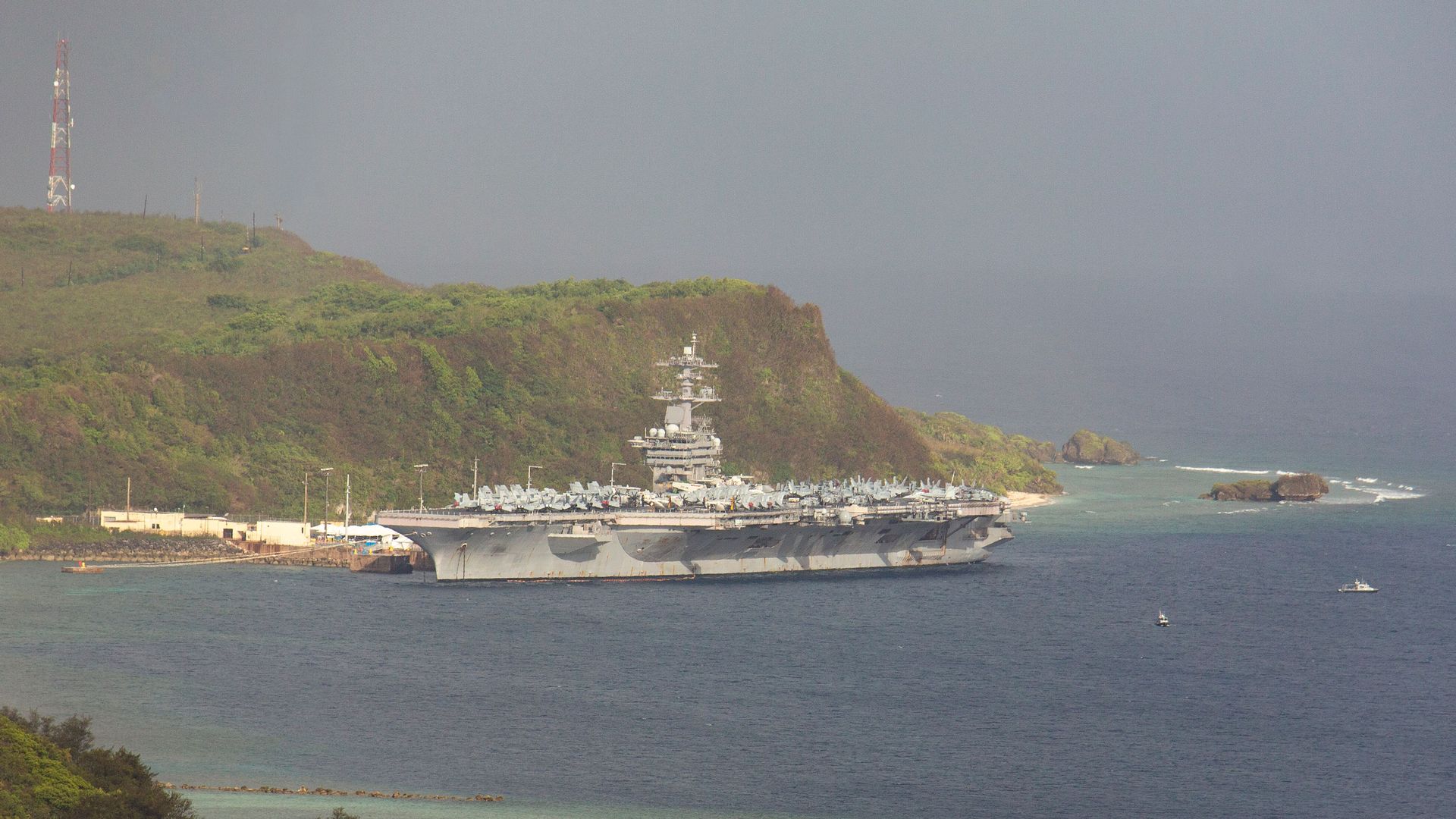 In this image, the Theodore Roosevelet sits by the coast