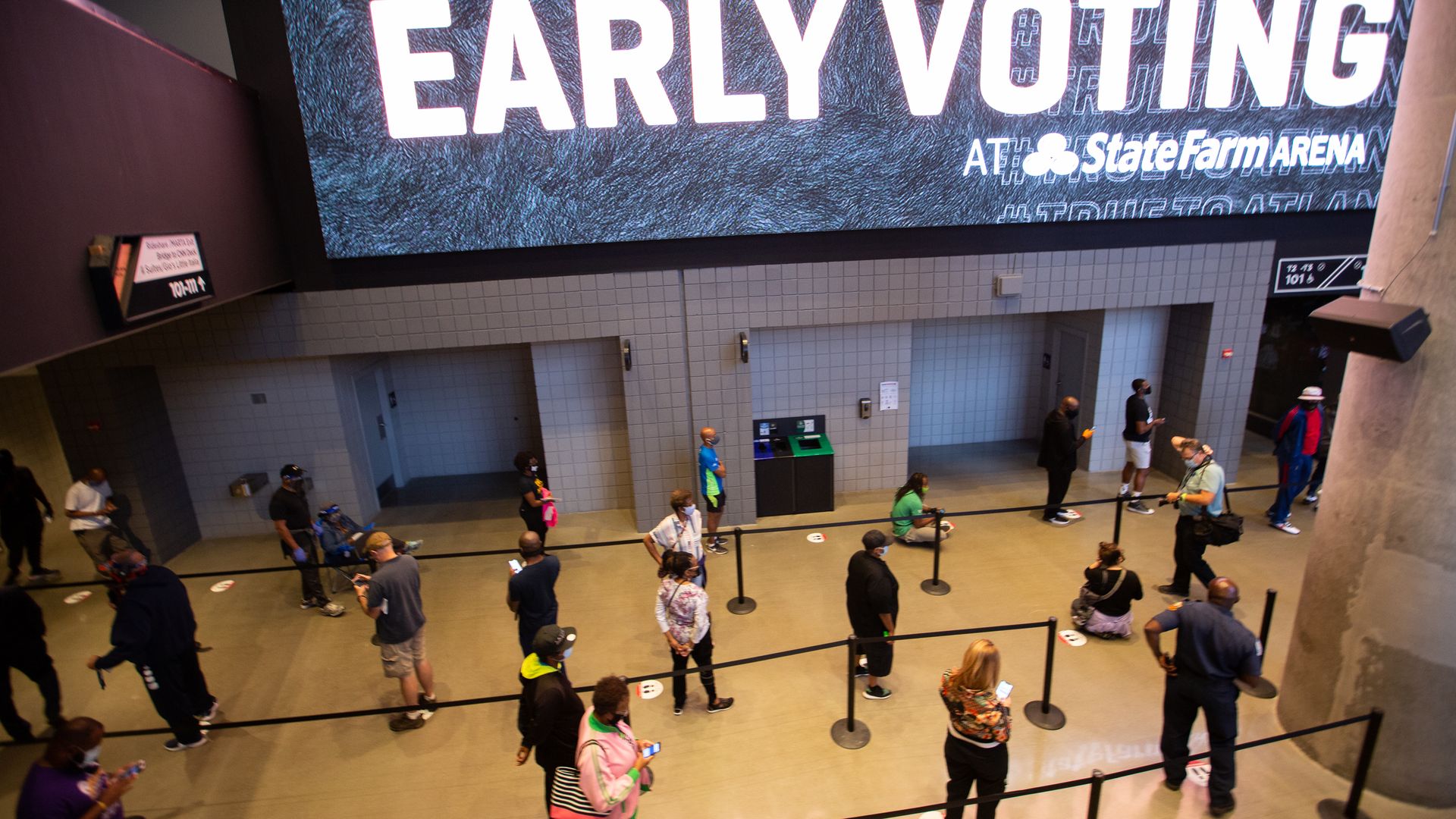 Voters line up inside of State Farm Arena, Georgia's largest early voting location, for the first day of early voting in the general election on October 12