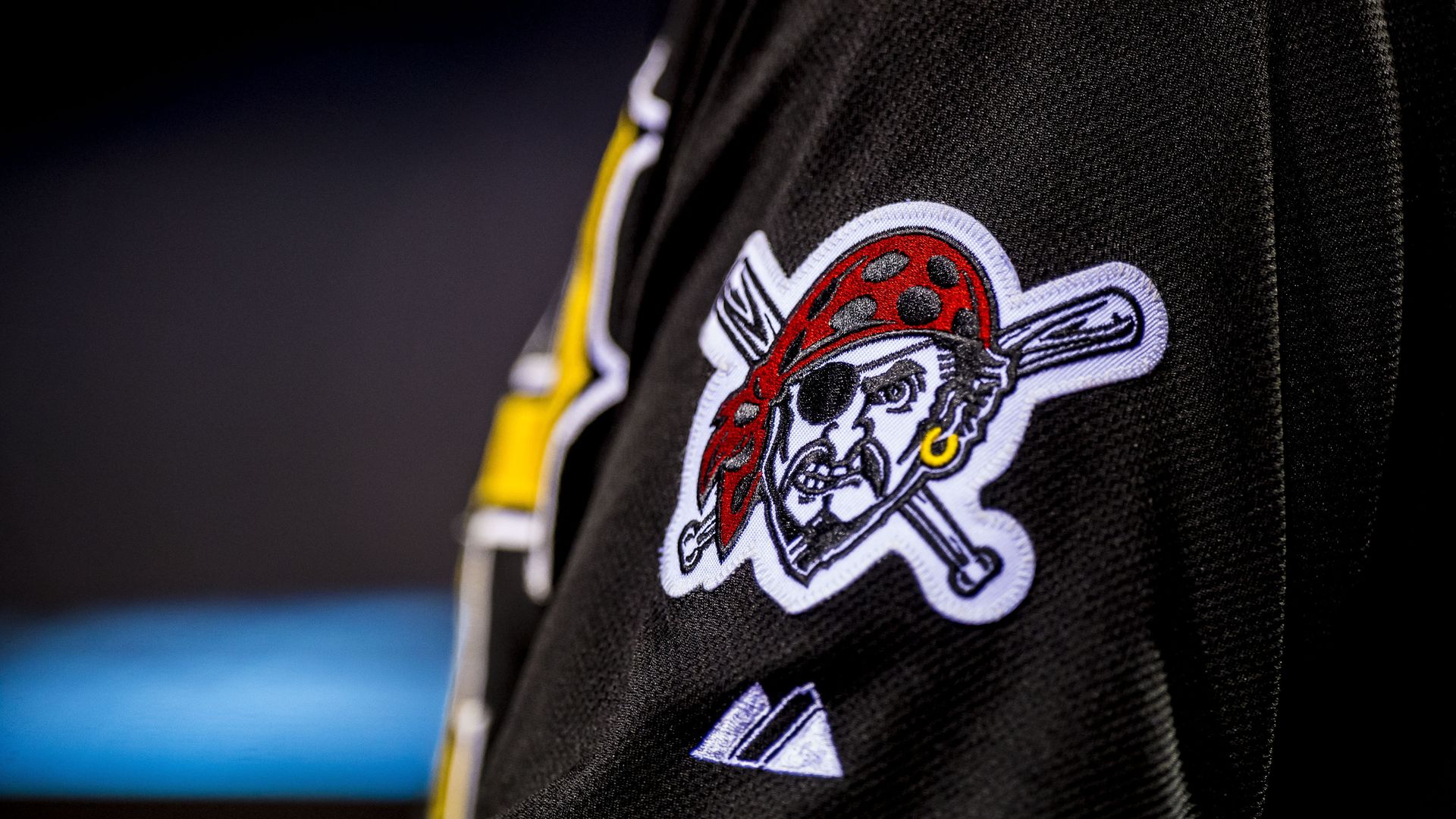 The Pirates logo eyes the field during a Major League Baseball game.
