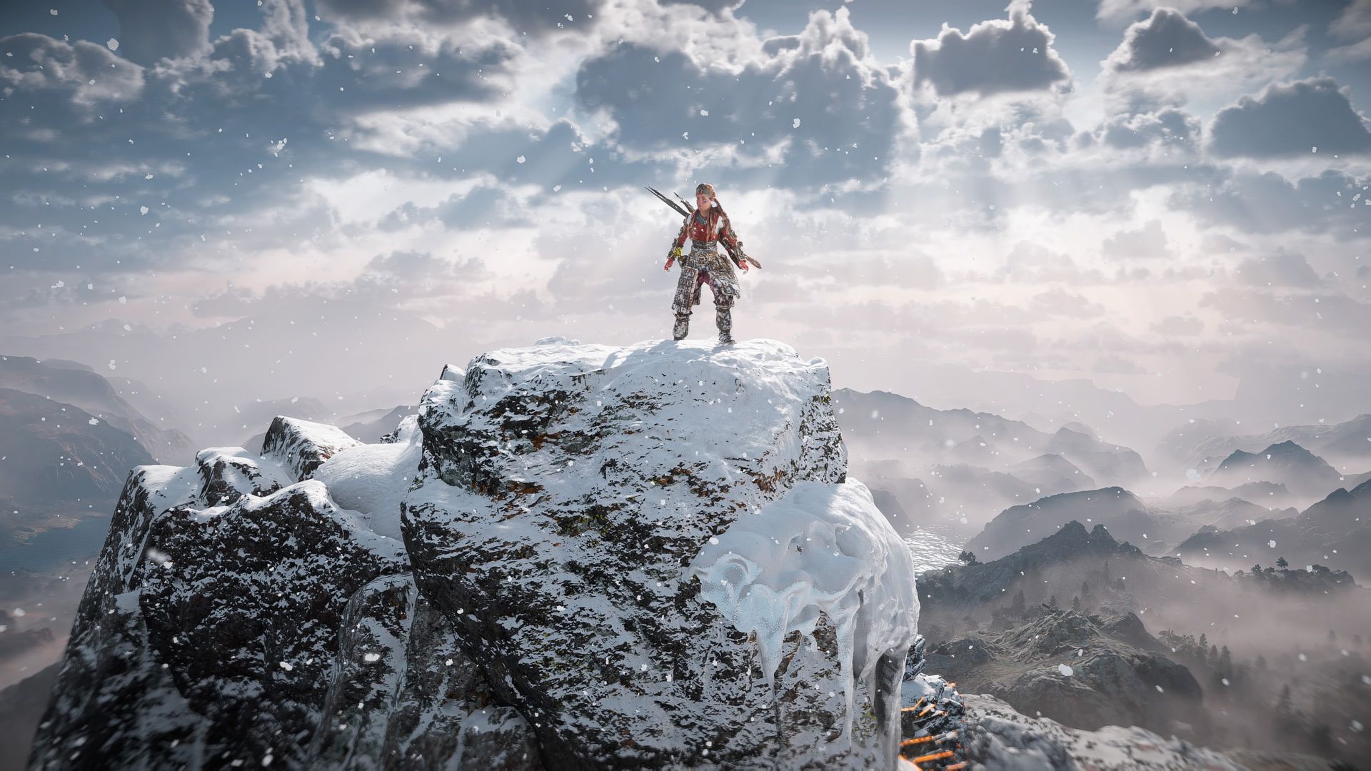 Video game screenshot of a warrior woman standing on a snowy mountaintop with sunrays beaming through clouds above her