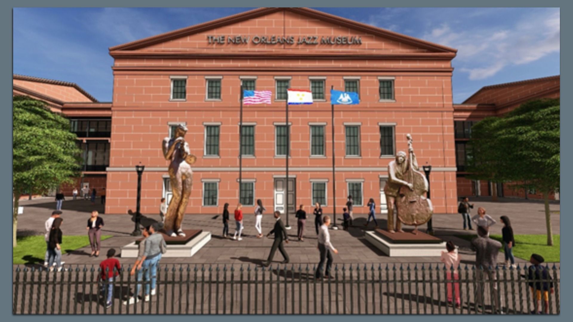 View of The New Orleans Jazz Museum with a brick facade, three flags, two large bronze musician statues, and people gathered outside on a sunny day with blue sky and trees.