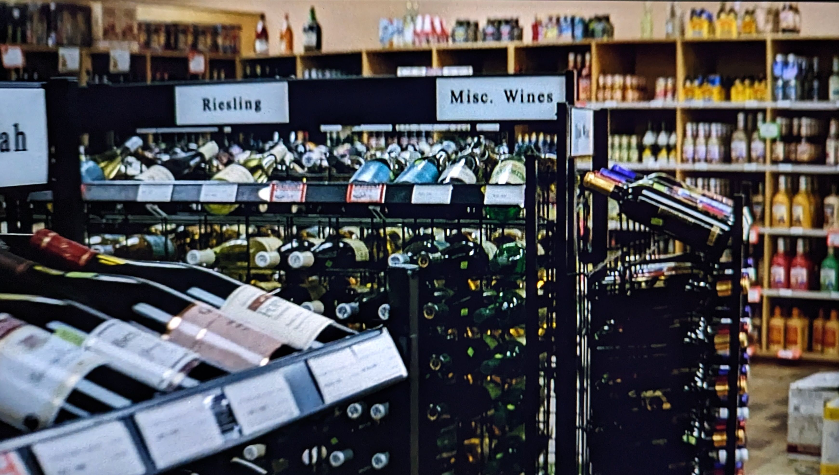 Racks of wine in a liquor store.