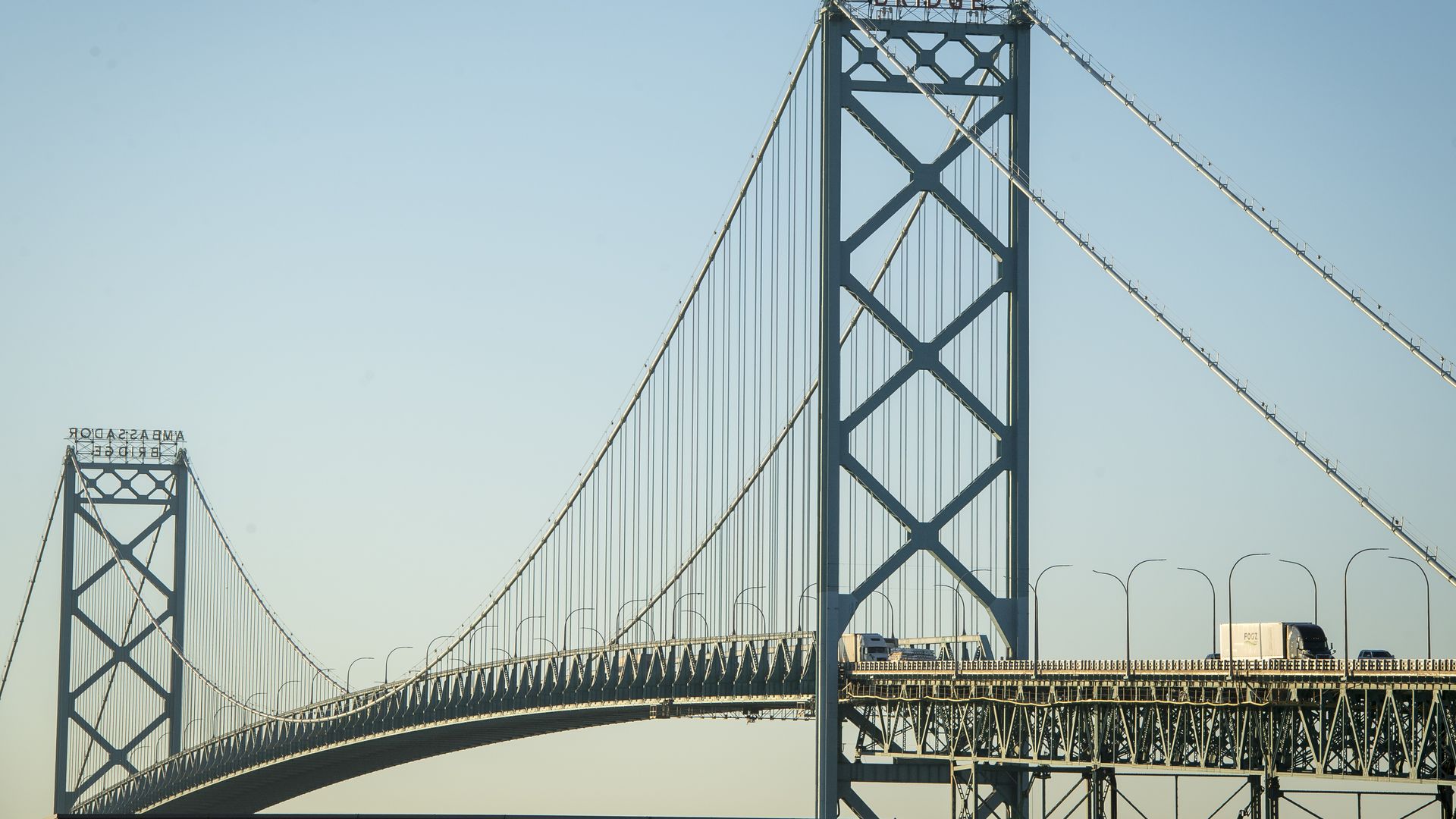 Vehicles travel across the Ambassador Bridge