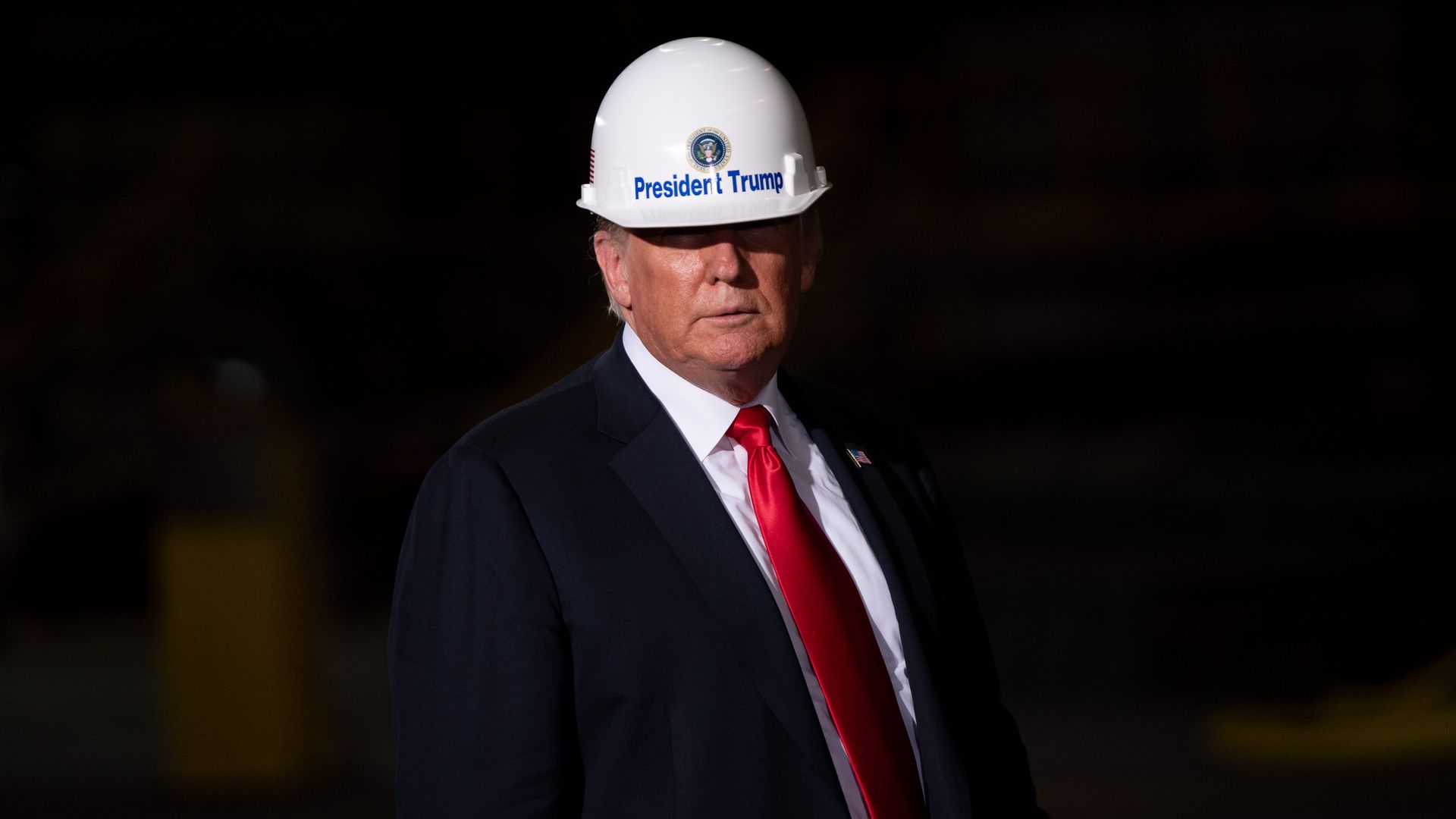 Donald Trump with a white hard hat on