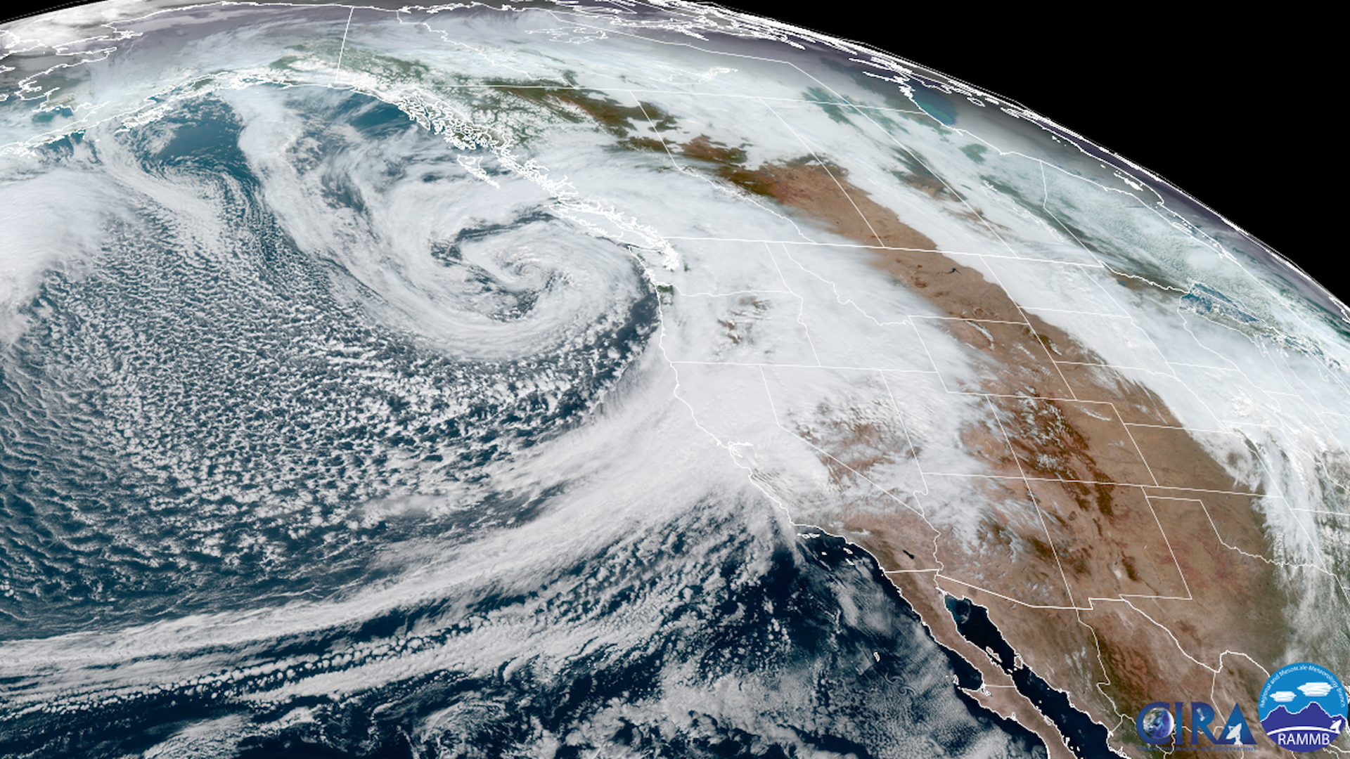 Satellite view of a powerful bomb cyclone off the Pacific Northwest and atmospheric river hitting California.