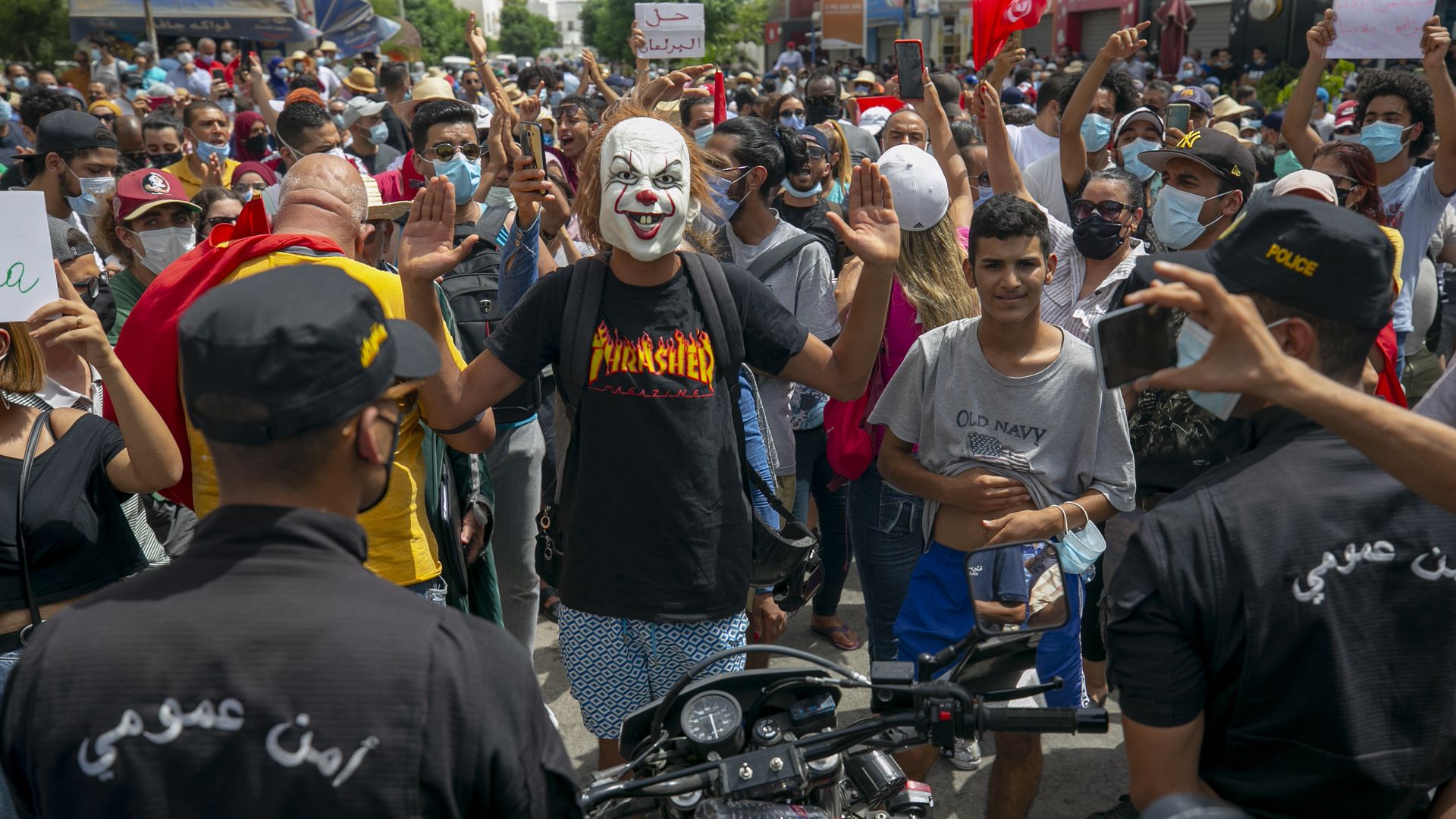 Protesters in Tunis meet a line of policemen 