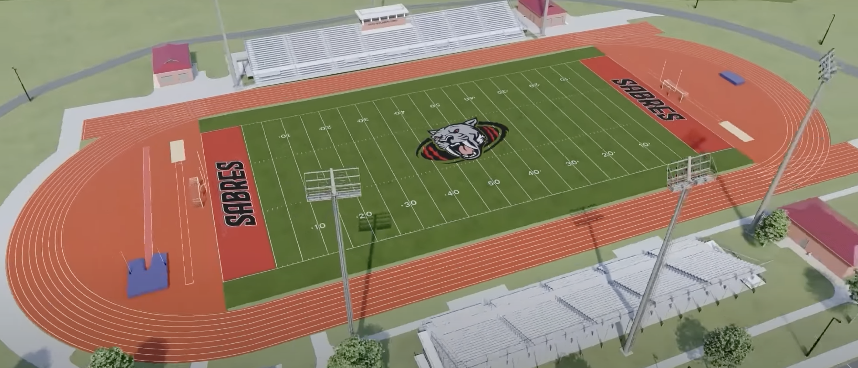 Aerial view of a green football field with red end zones labeled SABRES, a wildcat logo at midfield, orange running track around it, and seating stands on both sides.