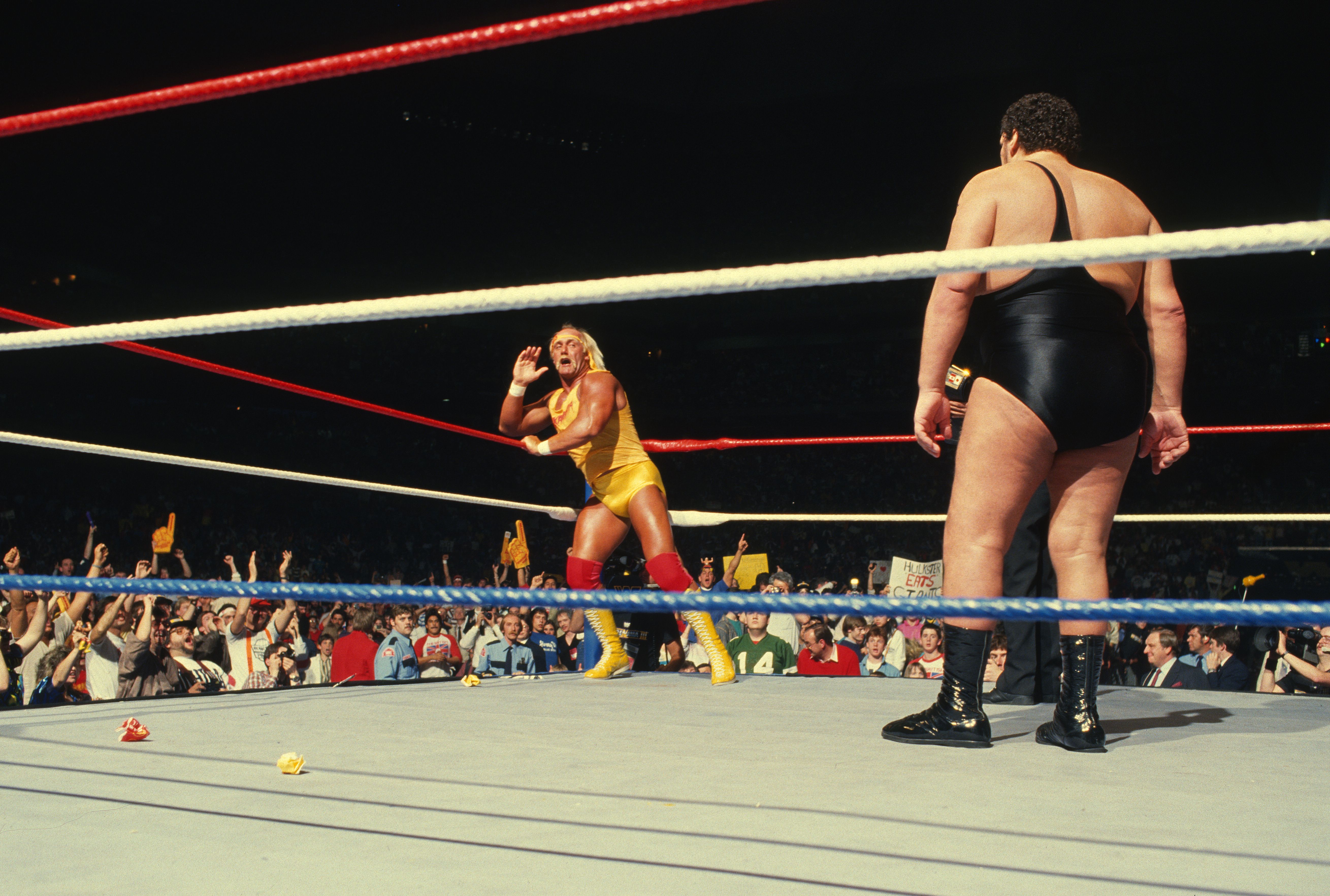 PONTIAC, MICHIGAN- MARCH 29: Hulk Hogan taunts Andre The Giant during WrestleMania III on March 29, 1987 at the Silverdome in Pontiac, Michigan.