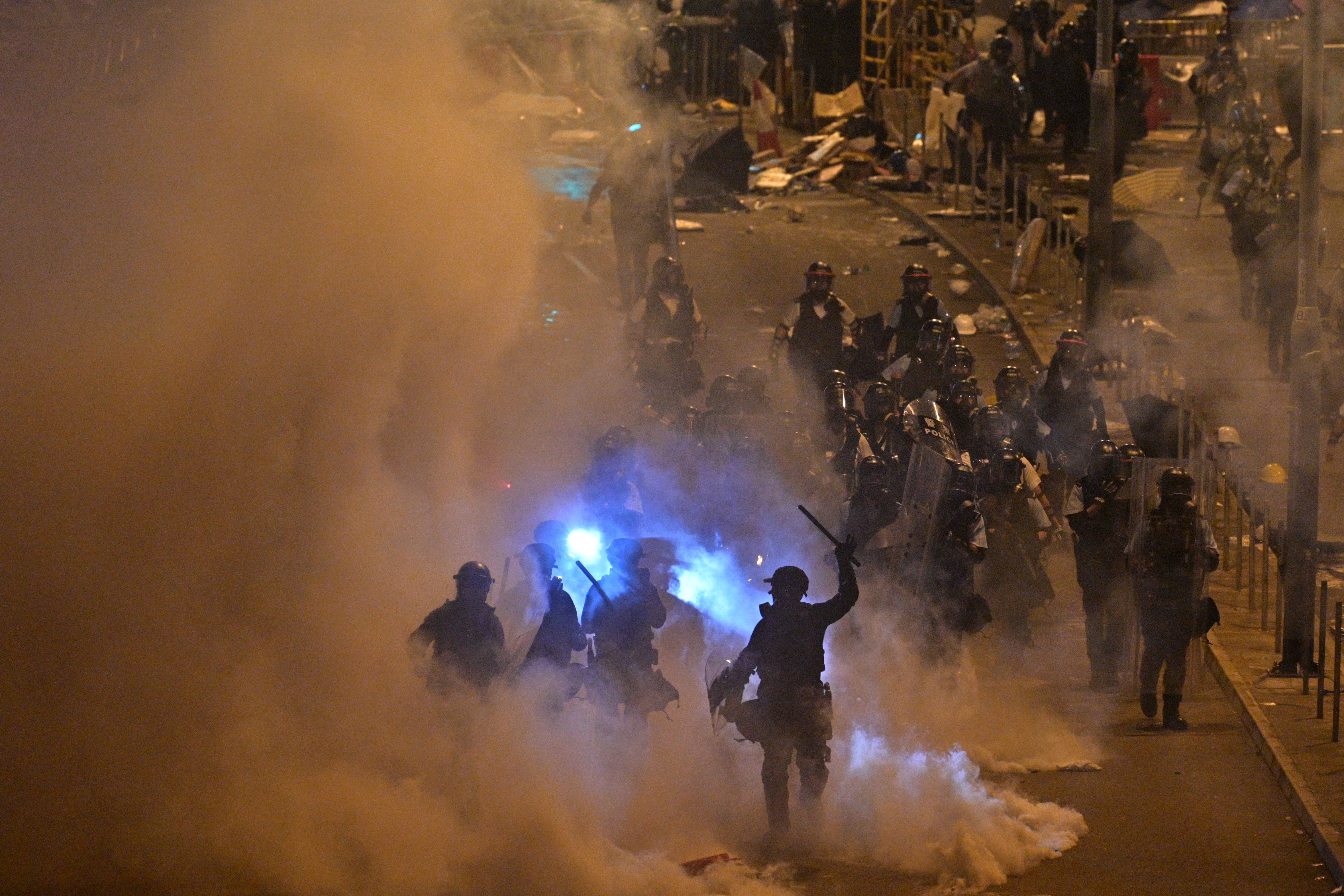 Police fire tear gas at protesters near the government headquarters in Hong Kong on July 2, 2019. 