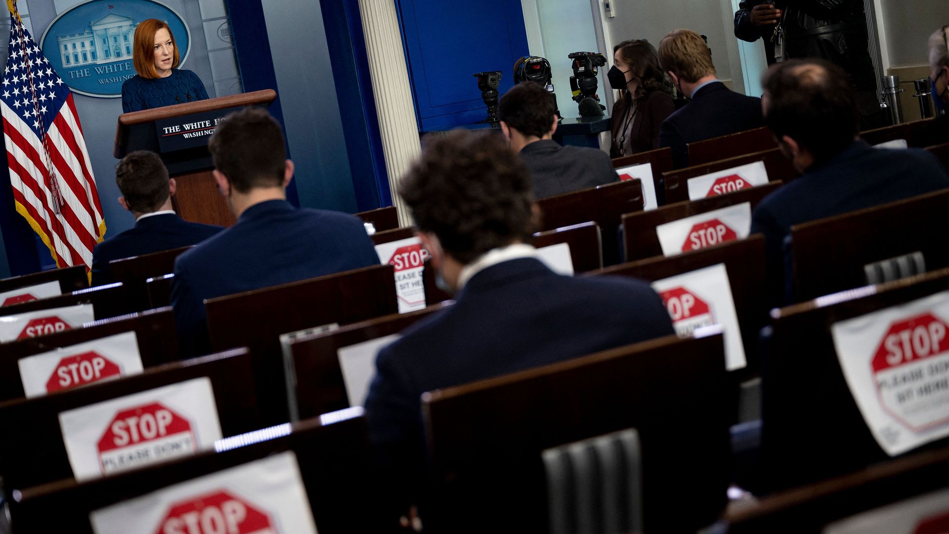 White House press secretary Jen Psaki is seen addressing reporters in a socially distanced Brady Briefing Room.
