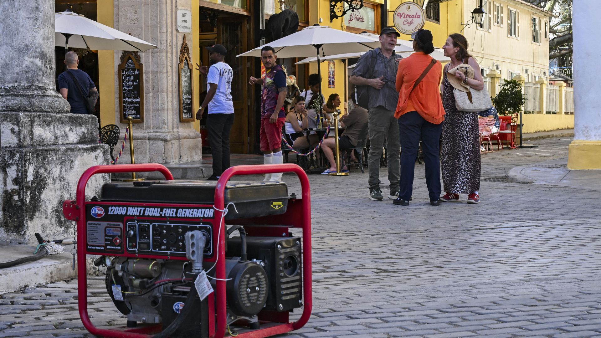 A shopkeeper uses a power generator after a blackout in Havana on March 5, 2026. Cuban authorities said on March 5, 2026 that electricity is slowly coming back to end a blackout that hit two-thirds of the beleaguered communist nation and stemmed from a lack of fuel under US pressure. (Photo by YAMIL