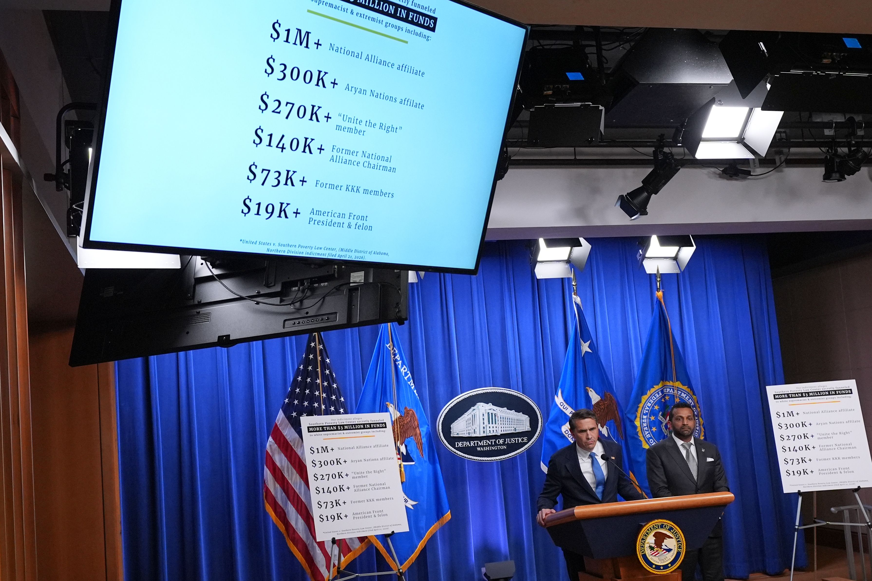 Acting Attorney General Todd Blanche and FBI Director Kash Patel speak during a press conference at the Justice Department in Washington yesterday.