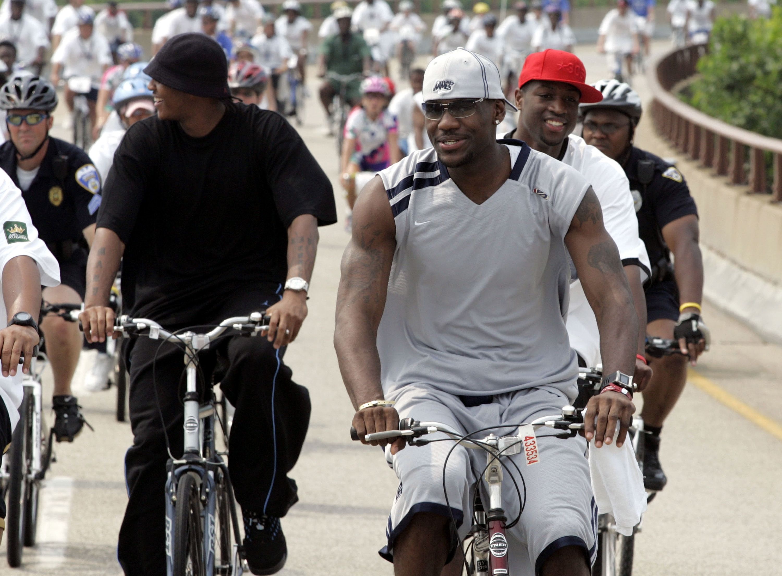 AKRON, OH - JUNE 25: LeBron James of the Cleveland Cavaliers (C), Dwyane Wade of the Miami Heat (R) and Carmelo Anthony of the Denver Nuggets (L) participate in the LeBron James Bikeathon on June 25, 2005 in Akron, Ohio. NOTE TO USER: User expressly acknowledges and agrees that, by downloading and o