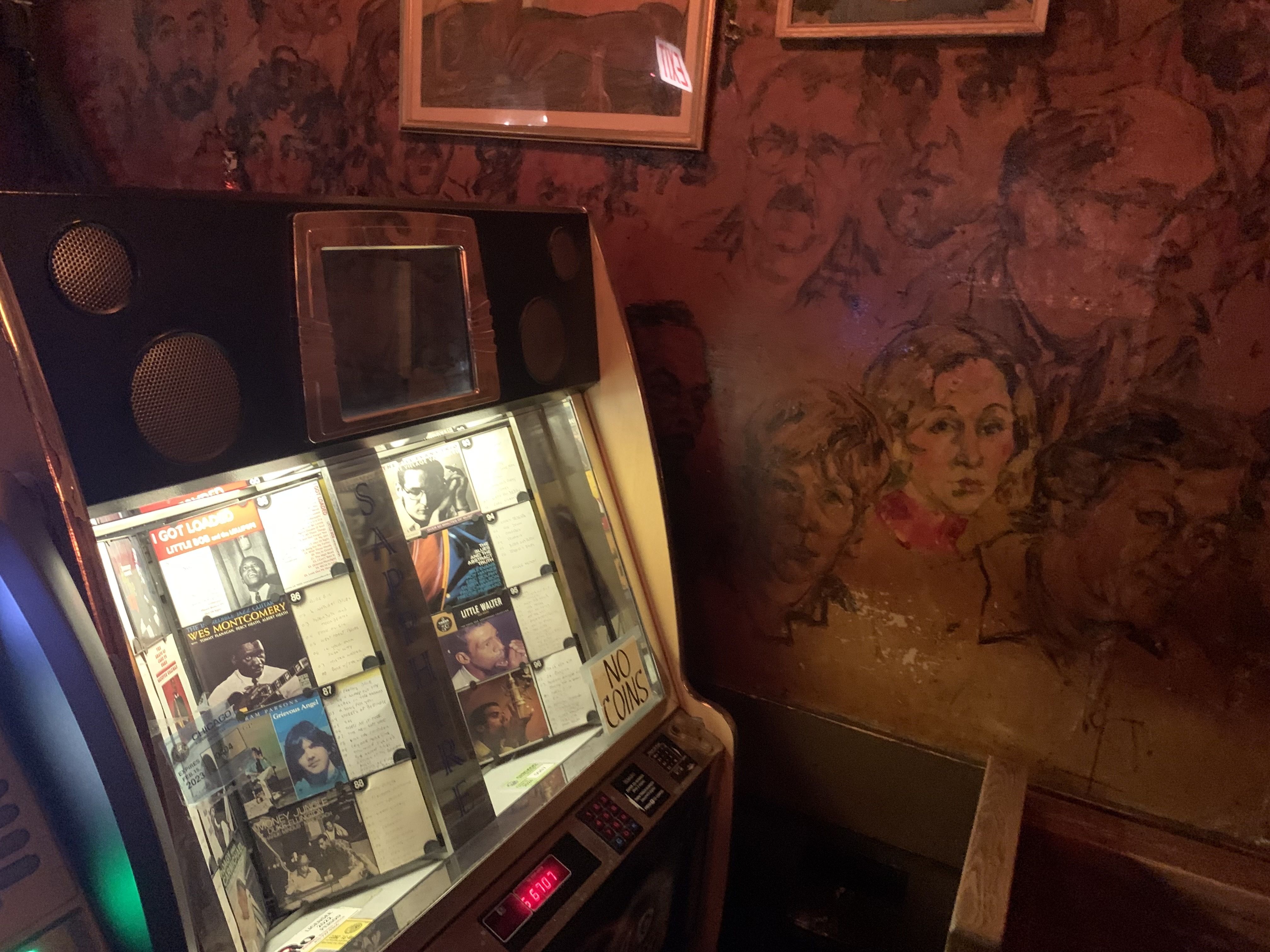 Photo of a jukebox at a bar. 