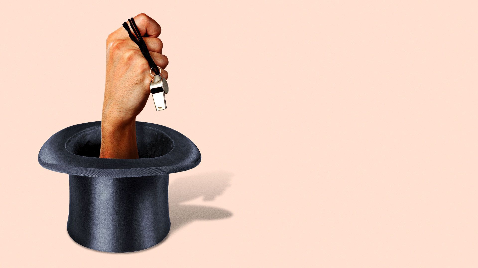 Hand carrying ref whistle coming out of a hat