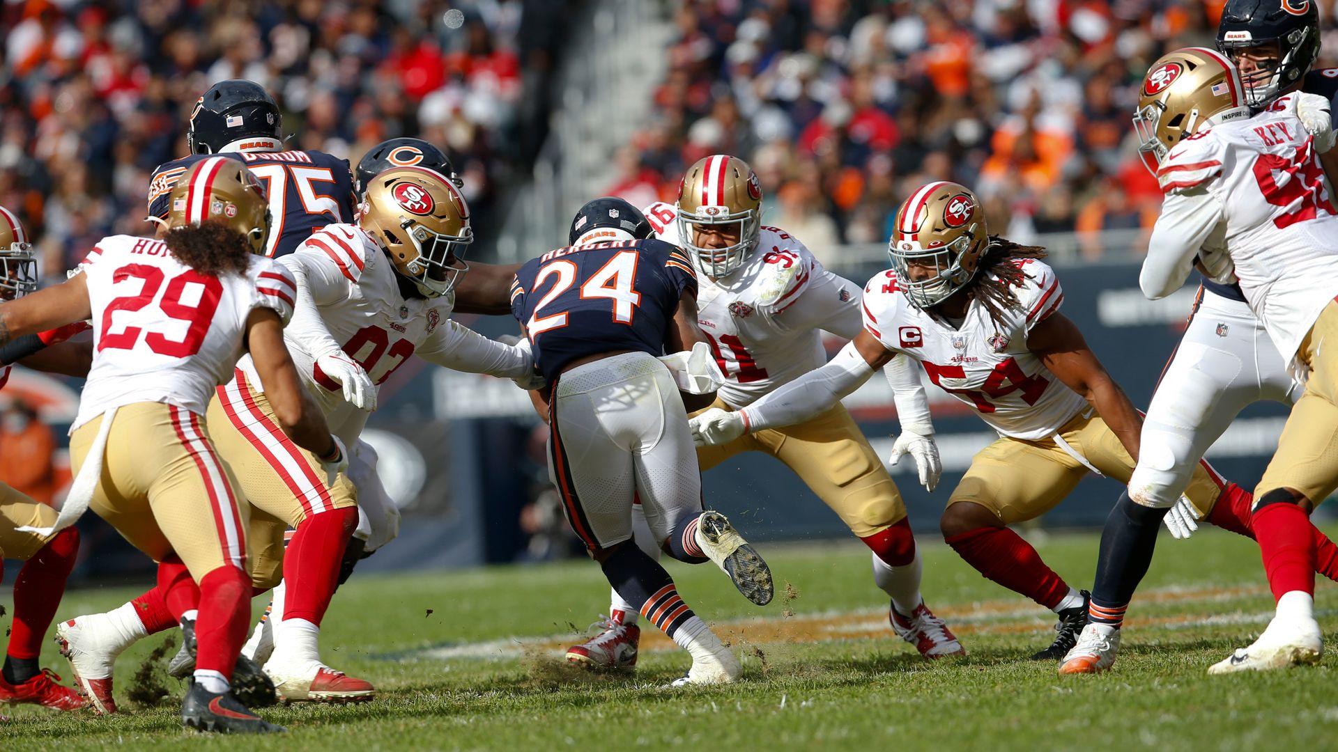 Chicago Bear's player surrounded by 49ers