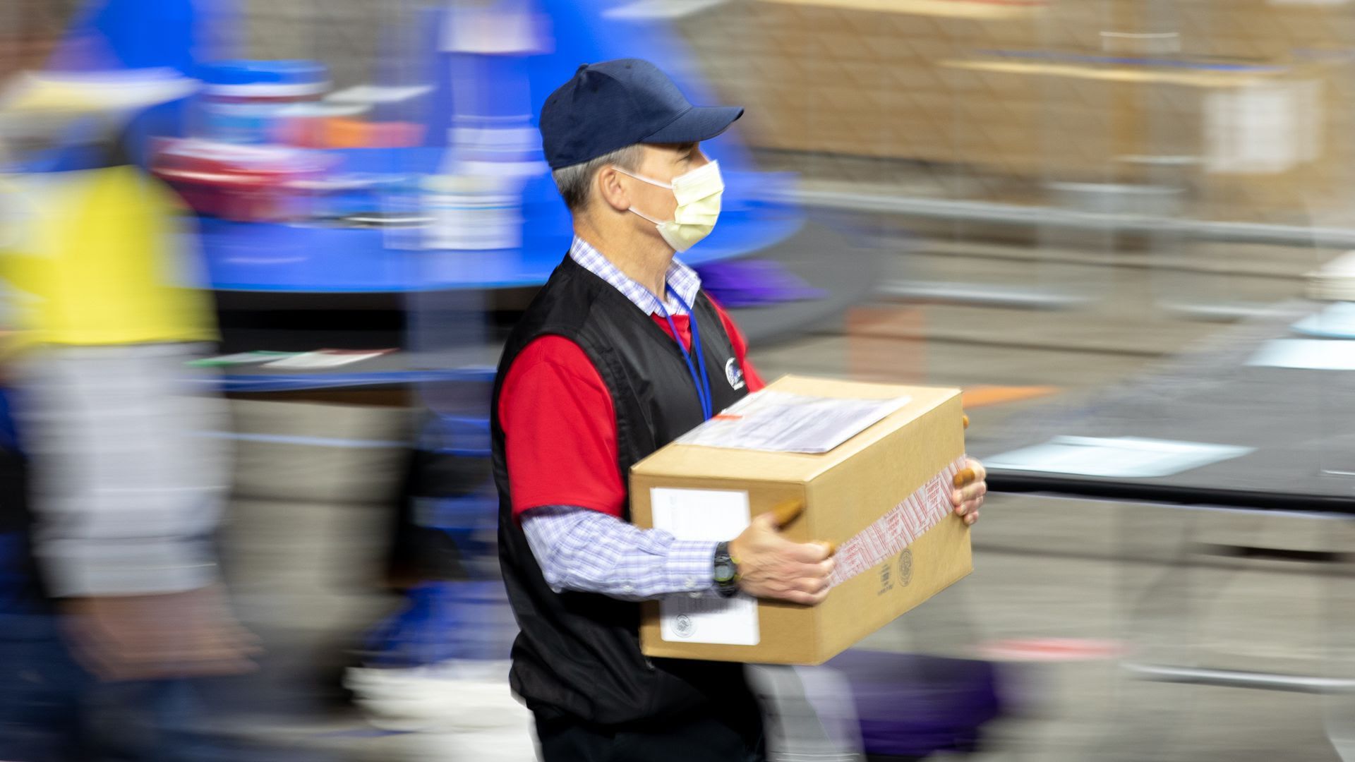 A contractor for Cyber Ninjas, who was hired by the Arizona State Senate transports ballots from the 2020 general election on May 1, 2021 in Phoenix, Arizona.