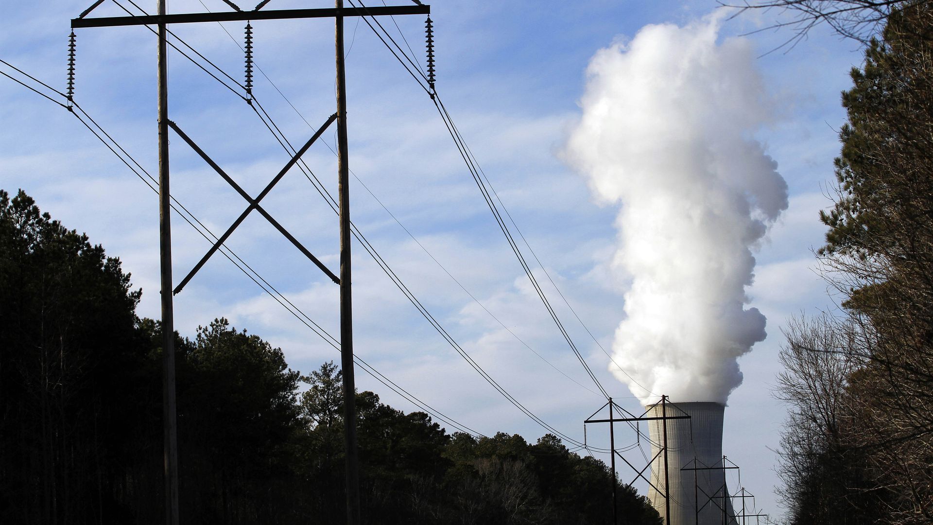 Steam rises from the cooling tower of Progress Energy Inc.'s Shearon Harris nuclear plant in New Hill, North Carolina, U.S., on Sunday, Jan. 9, 2011. Duke Energy Corp. is nearing an agreement to buy Progress Energy Inc. to form the largest U.S. utility, said three people with knowledge of the matter