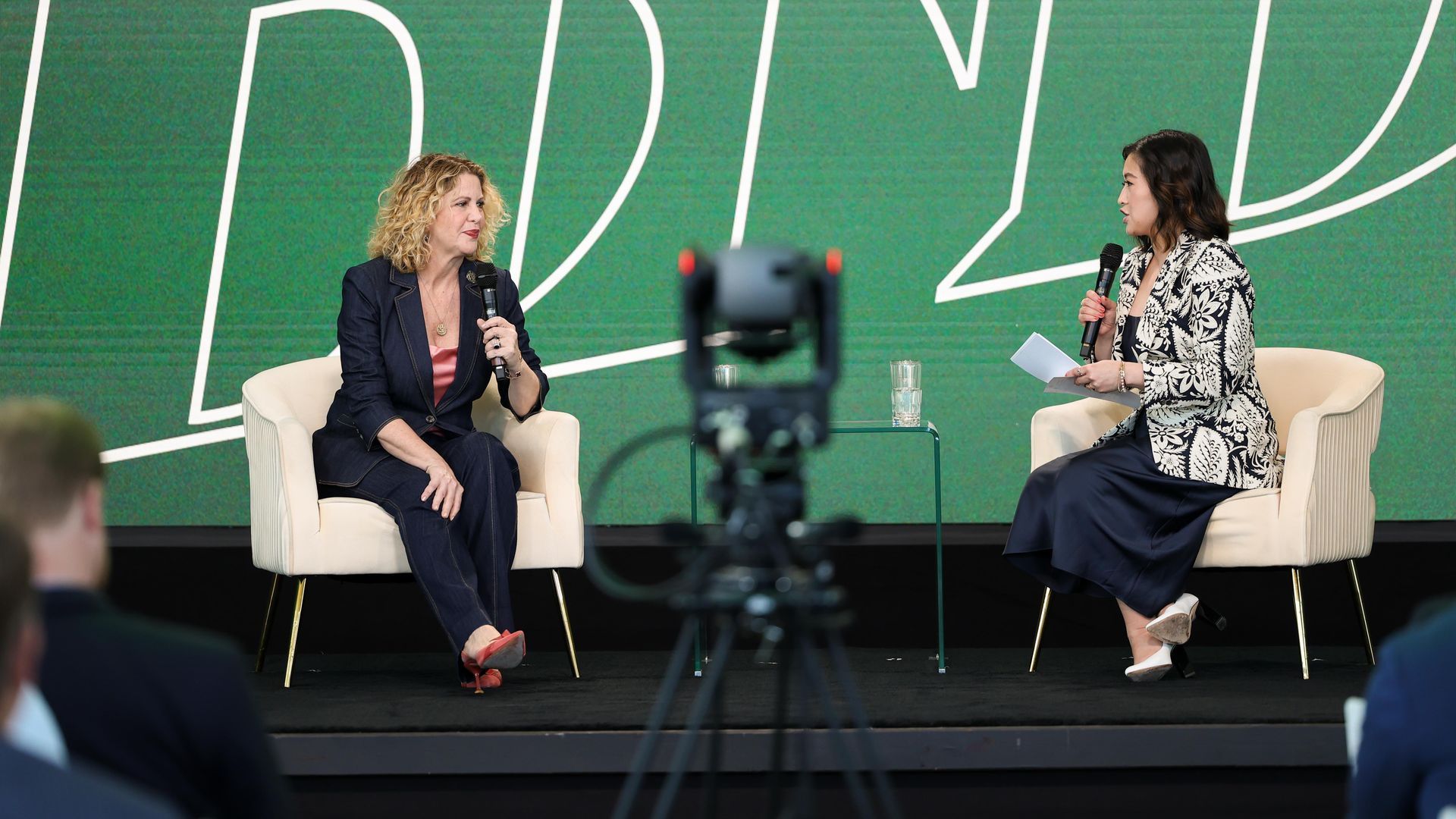 two women on stage talking