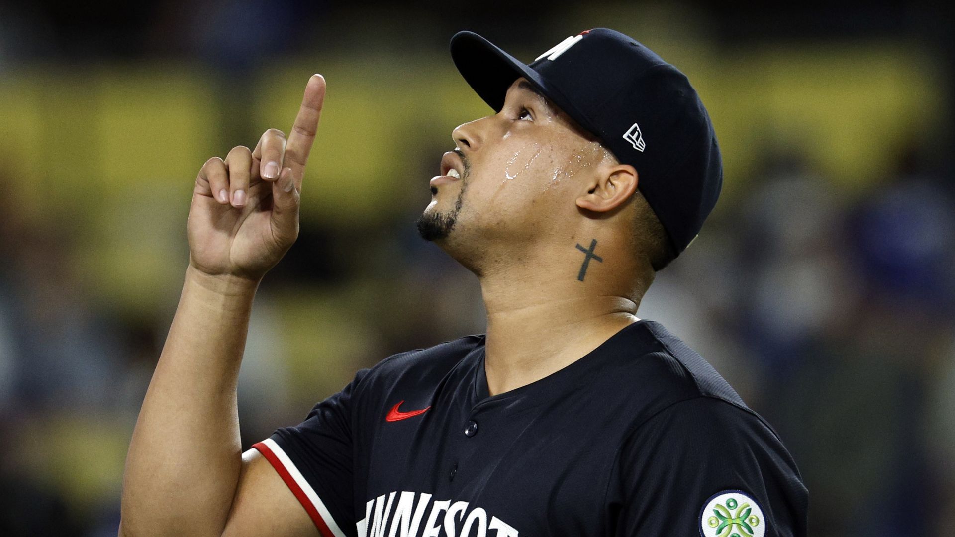 Phillies newly acquired closer Jhoan Duran points to the sky. 
