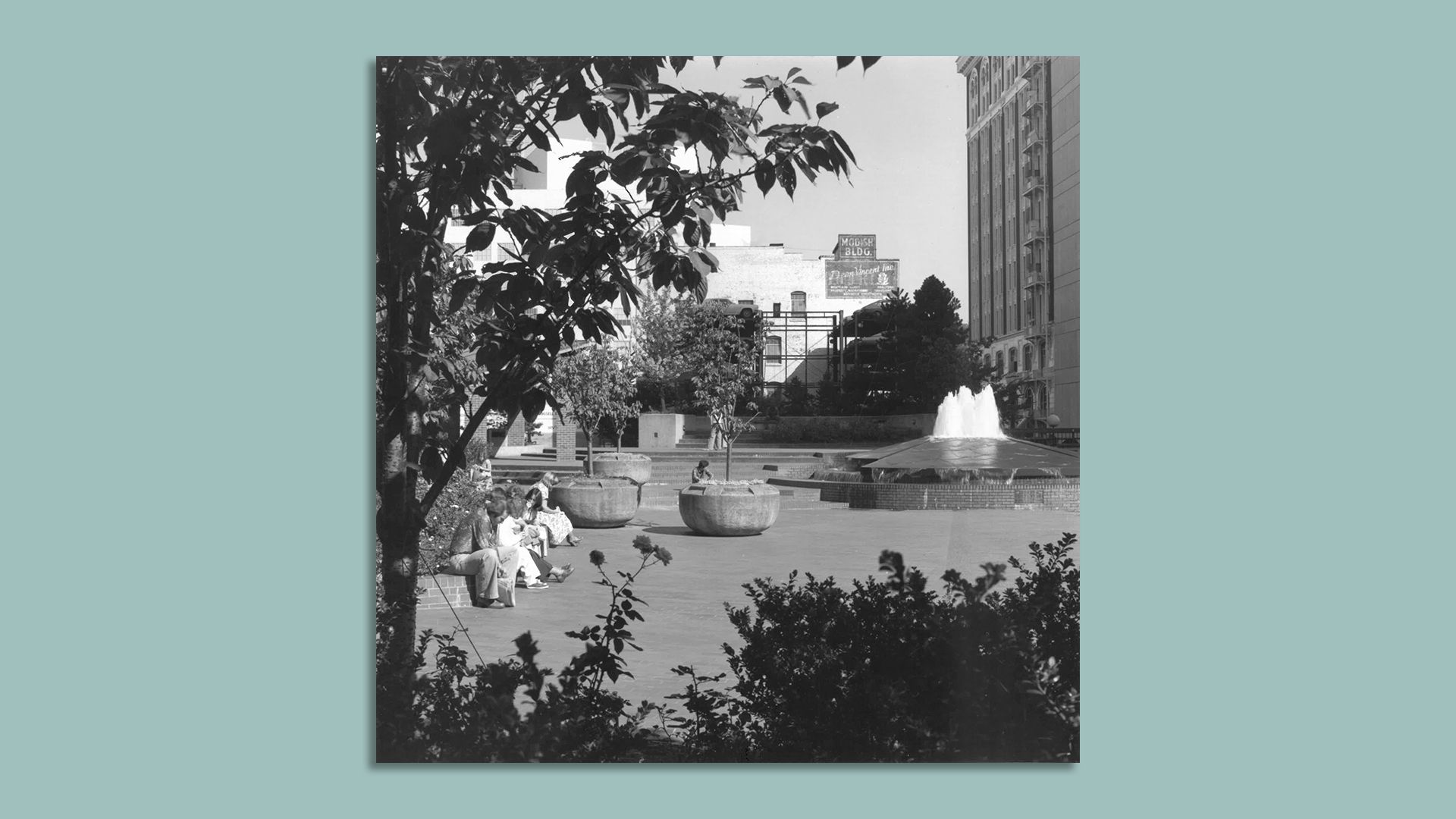 An archival image of O'Bryant Square park in Portland with the rose-shaped fountain in the background.