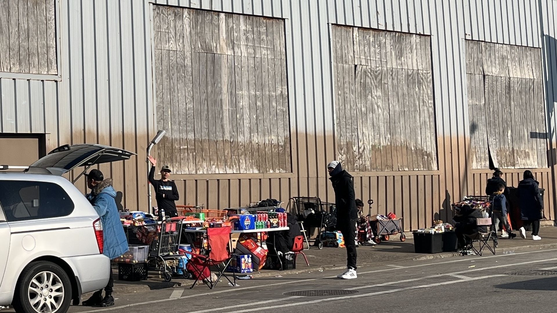 Photo of a building with people mulling about in front of it