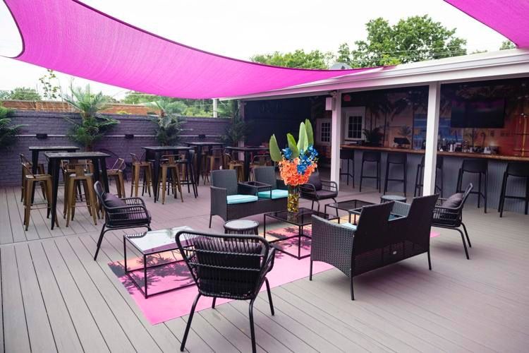 a rooftop with pink banners 