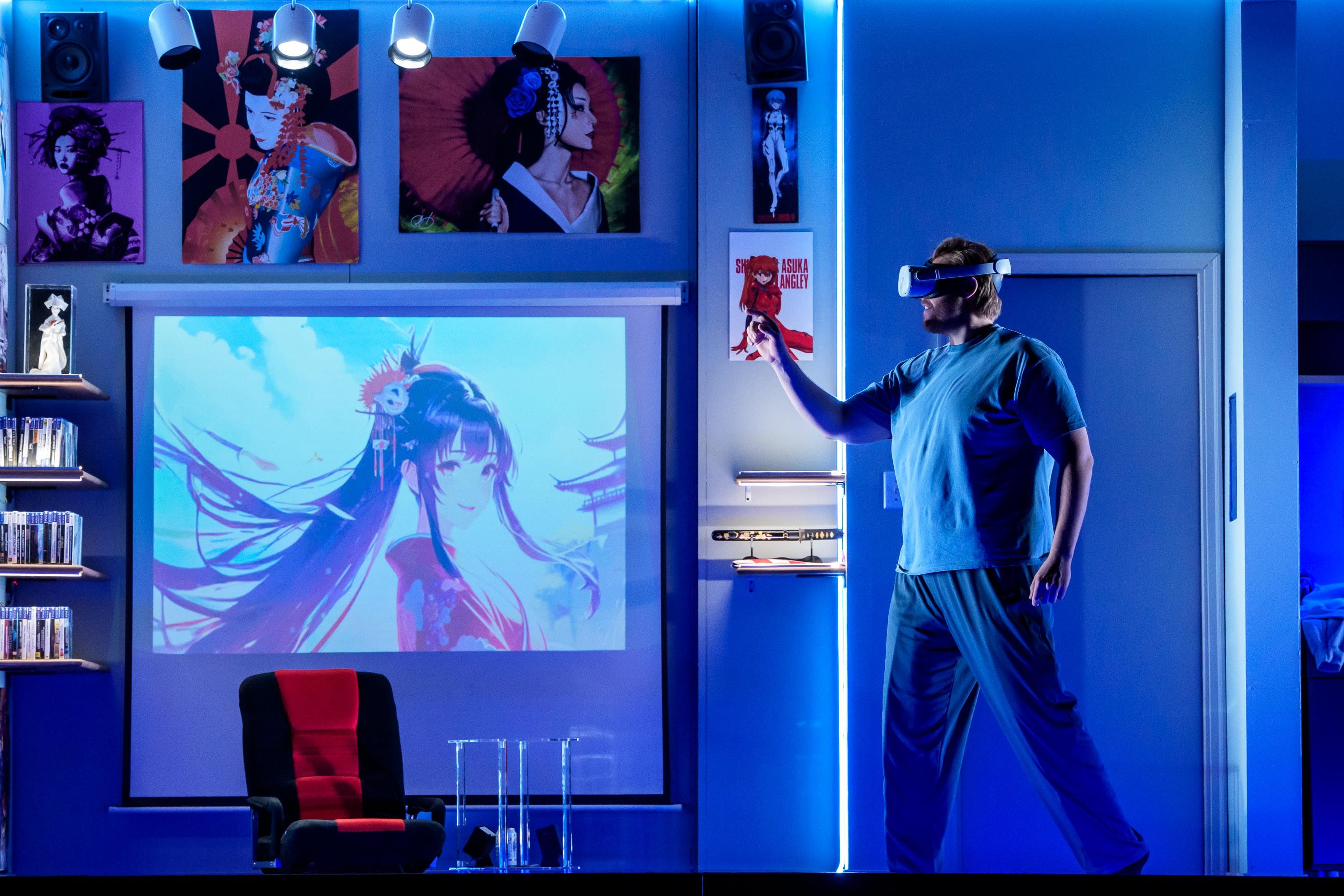 Man with VR goggles in a room with anime picture