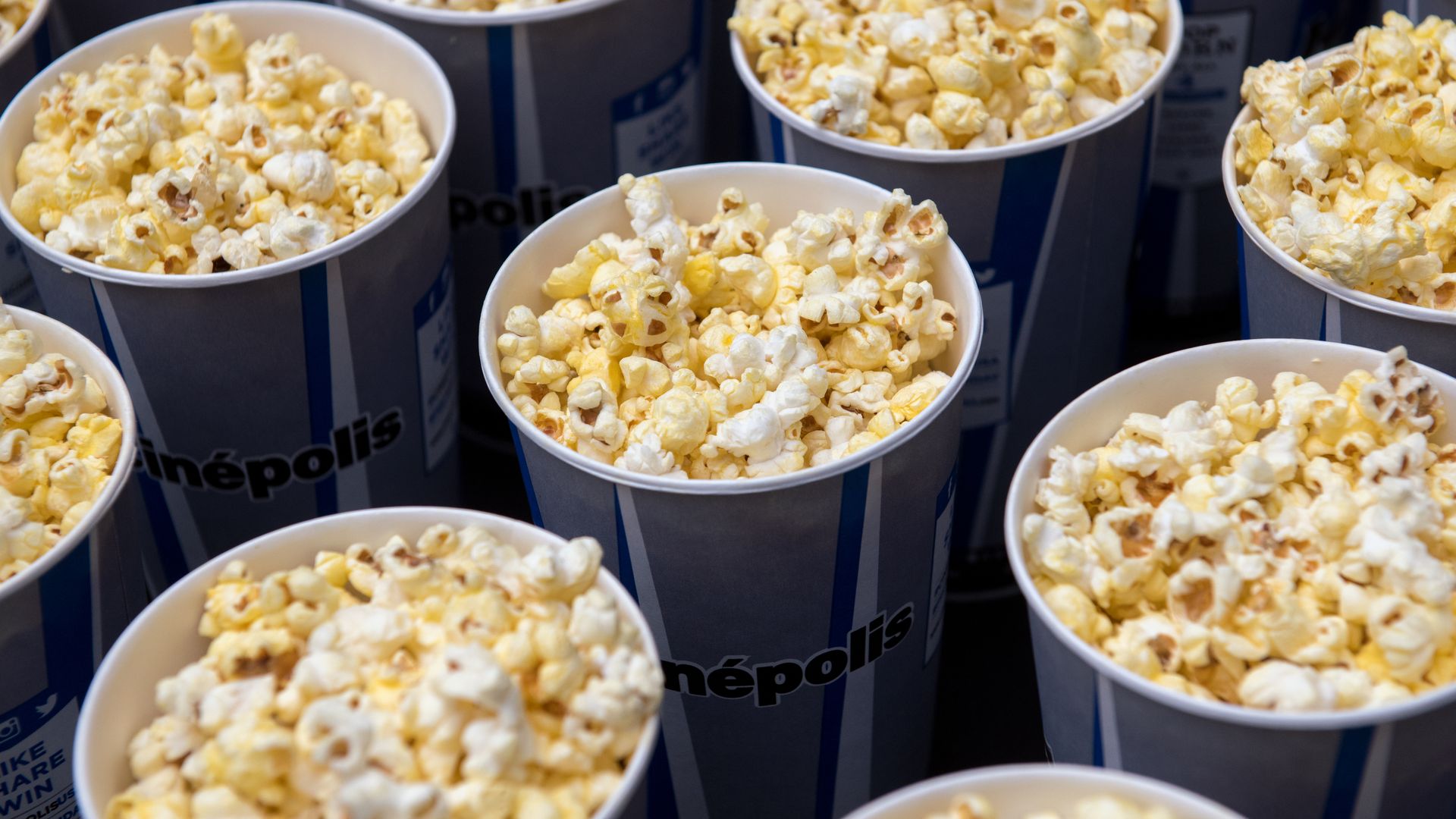Buckets of movie theater popcorn.