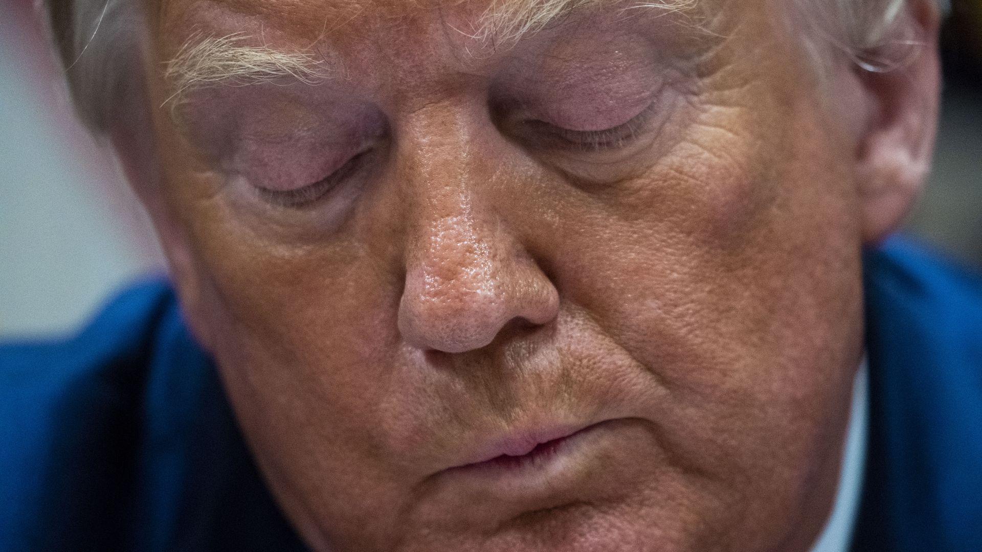 Photo of President Trump looking down