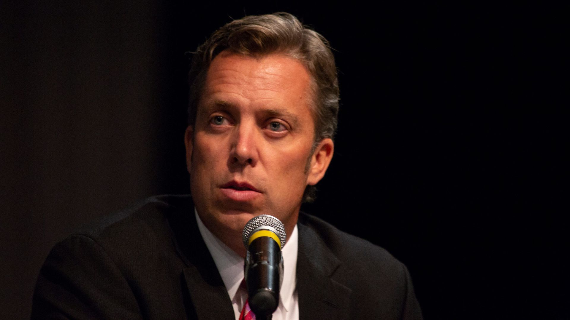 Andy Ogles speaks into a mic