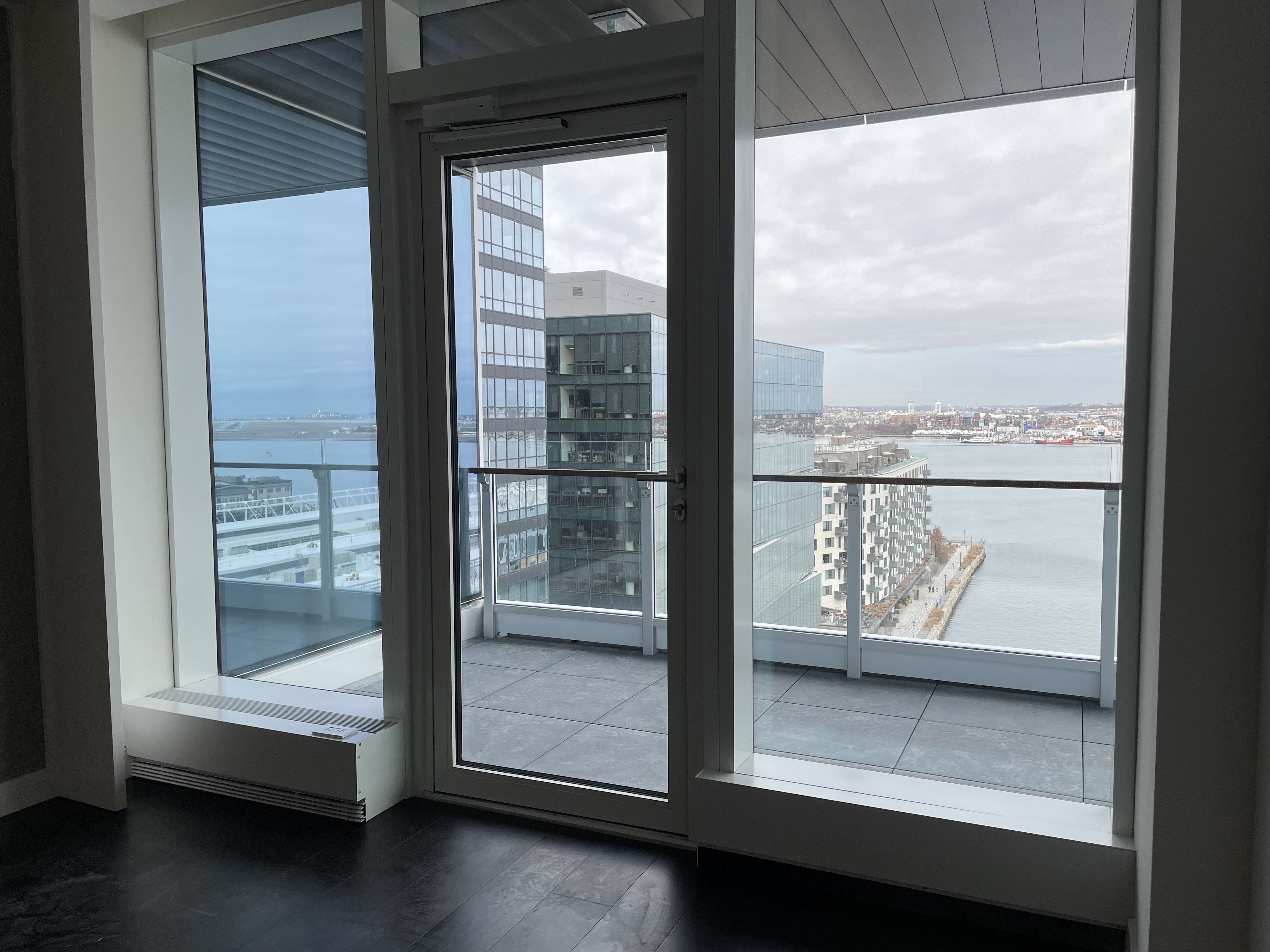 A door in one St. Regis condominium leads to a balcony with waterfront rooms. 