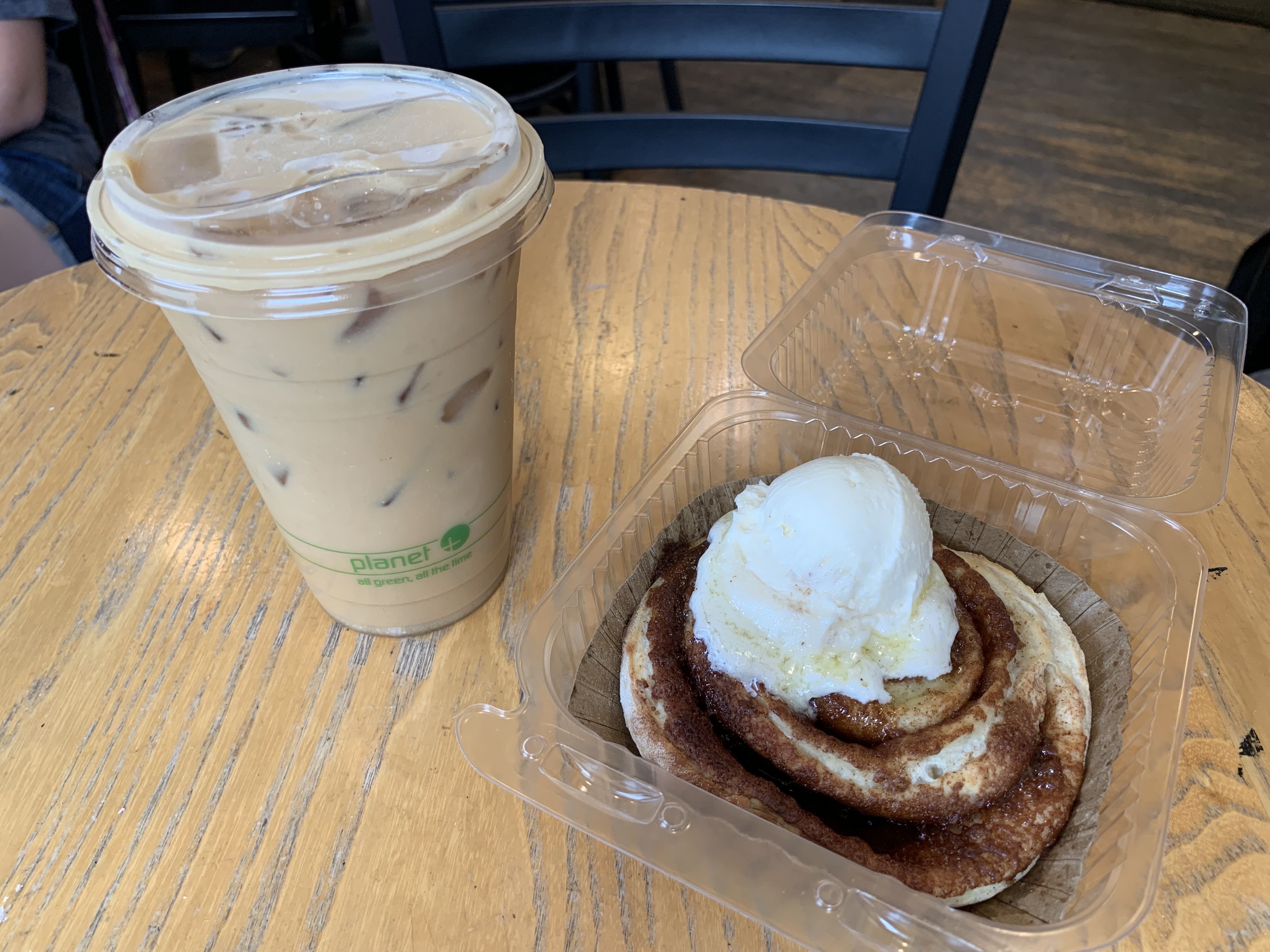 Photo of a cinnamon roll and coffee. 