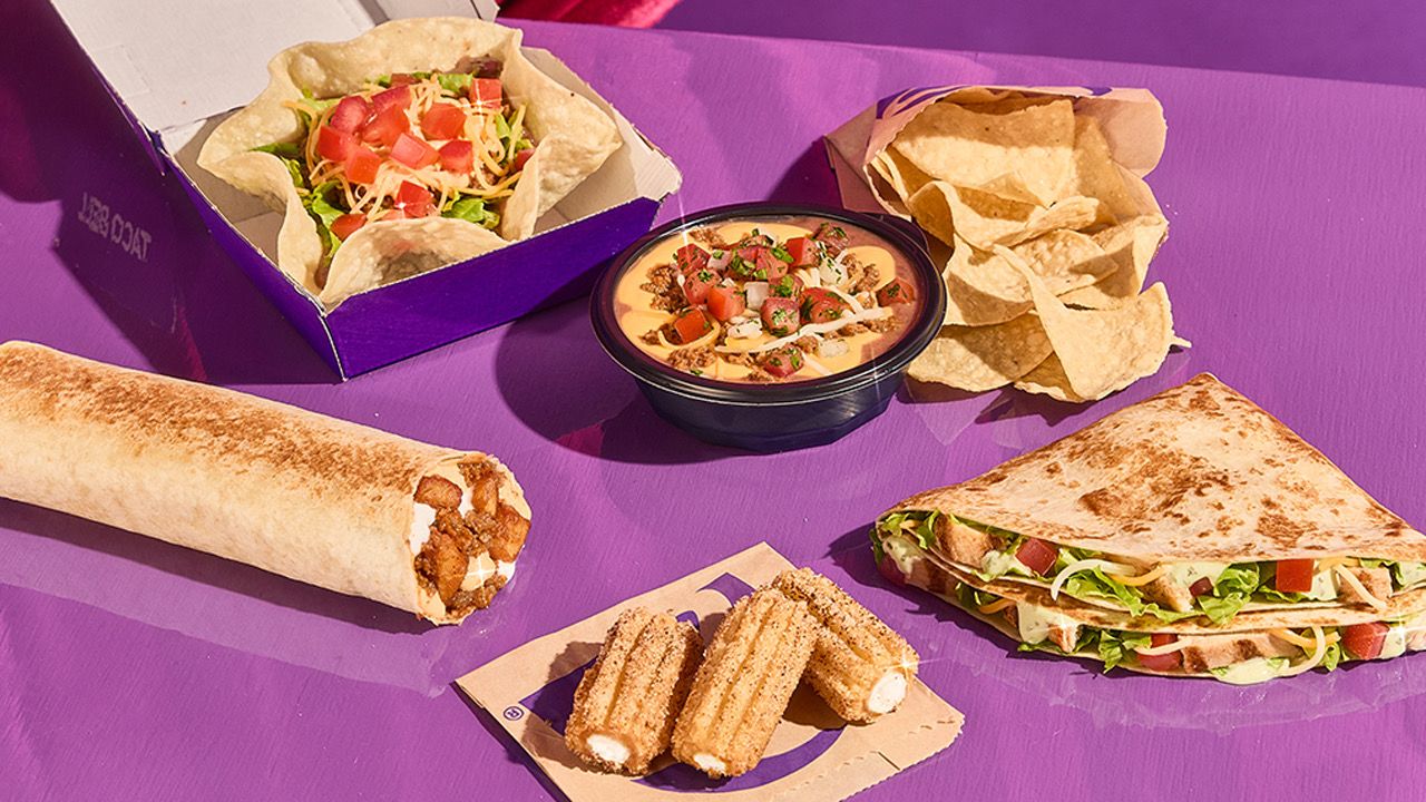 Photo of multiple Taco Bell items on a purple table