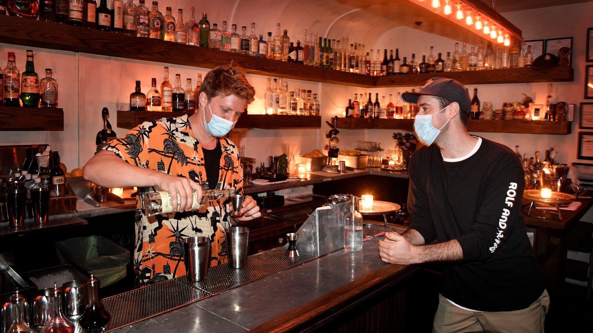 A bartender in a Hawaiin shirt pours a drink at Attaboy in East Nashville. 