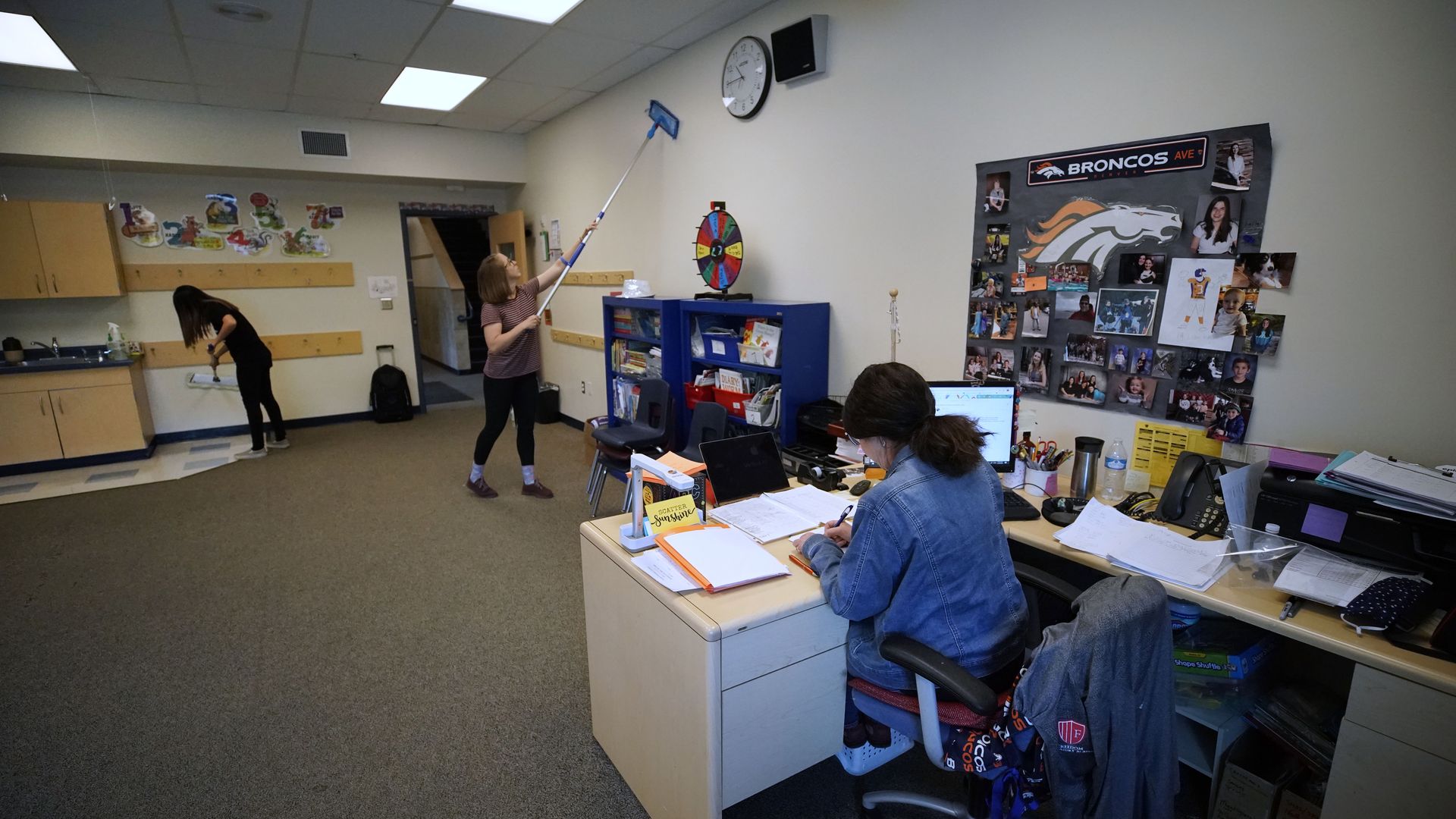 Students cleaning a classroom in March in Provo, Utah.
