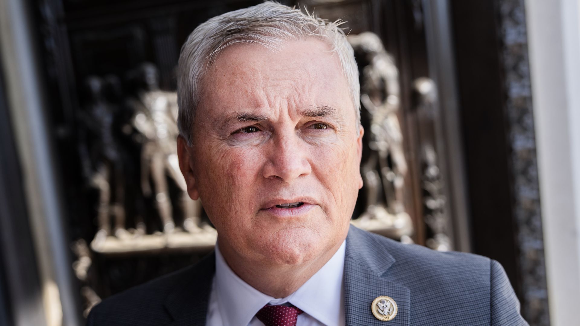 A picture of James Comer, closely cropped to his head, wearing a suit and congressional pin