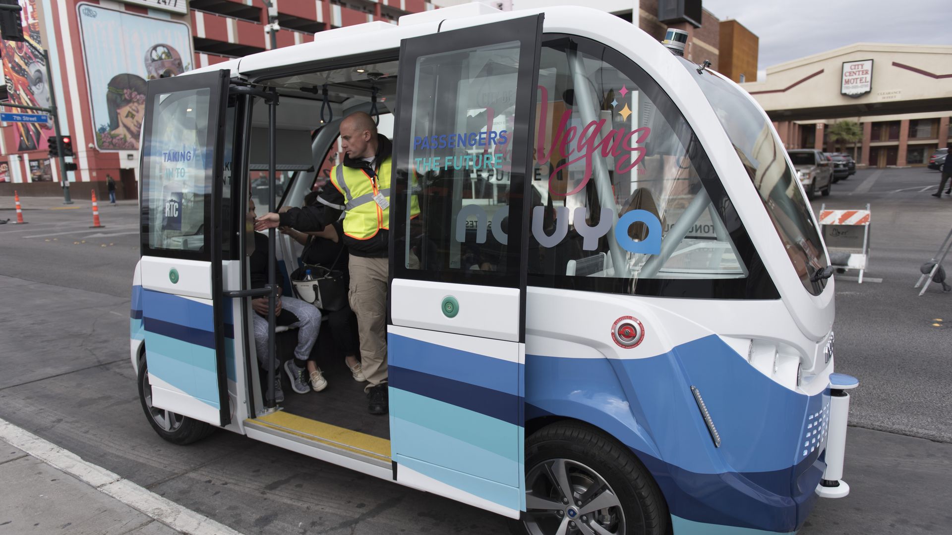 self-driving shuttle on Fremont Street in Las Vegas with passengers on board