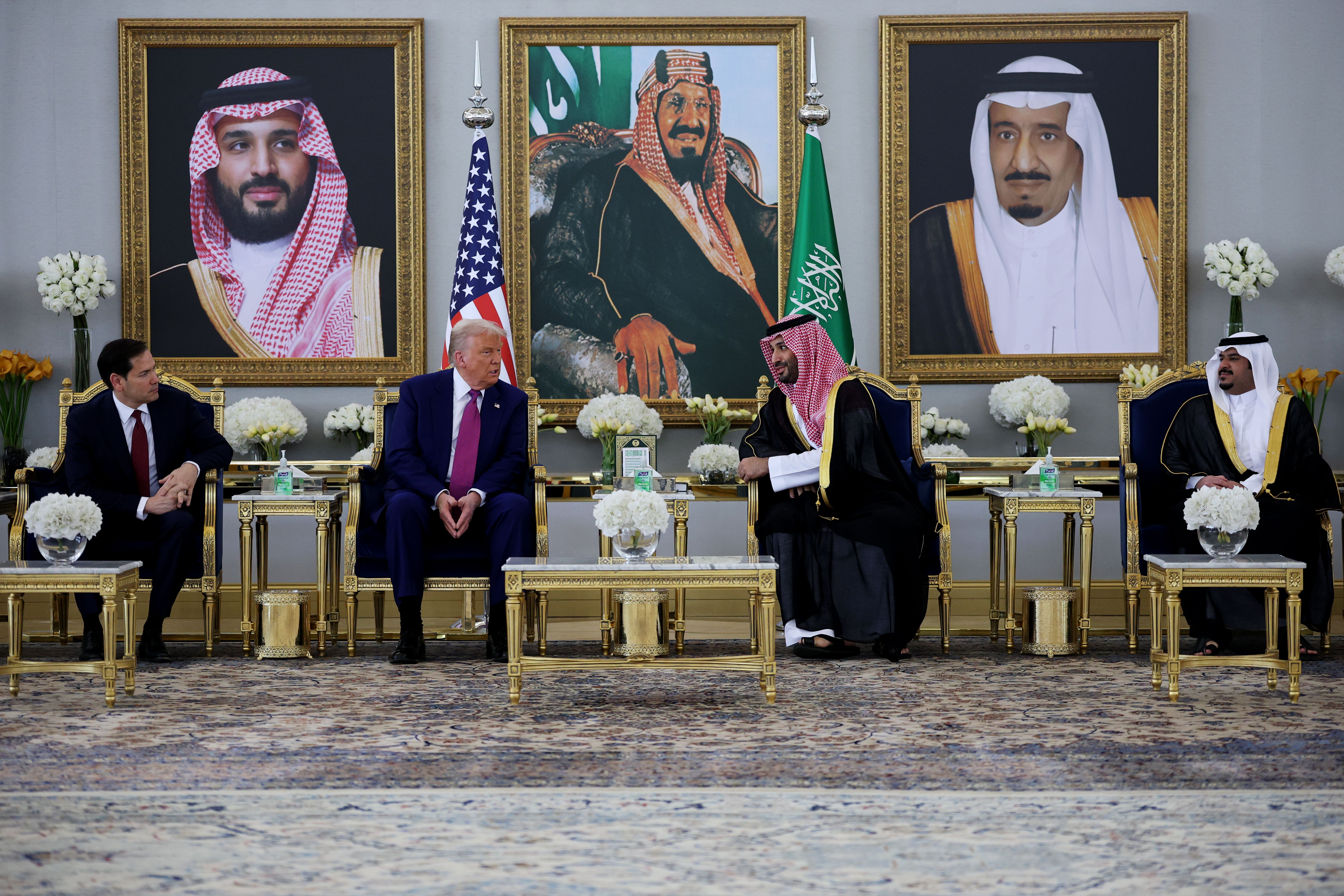 President Donald Trump meets with Saudi Crown Prince Mohammed bin Salman as he arrives at King Khalid International Airport on May 13, 2025, in Riyadh, Saudi Arabia. Trump begins a multi-nation tour of the Gulf region focused on expanding economic ties and reinforcing security cooperation with key U