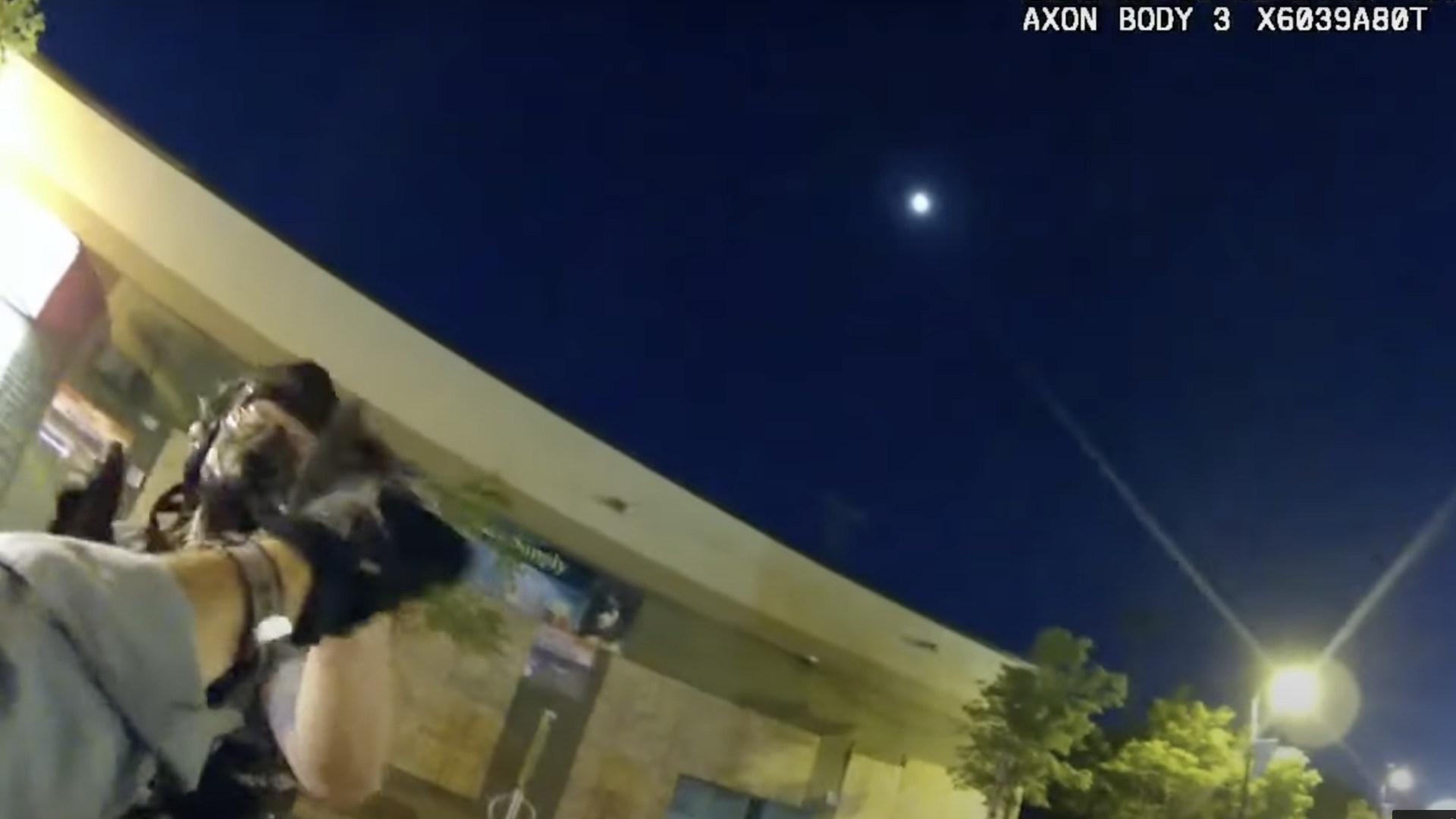 Body camera footage of two Minneapolis police officers pounding fists.