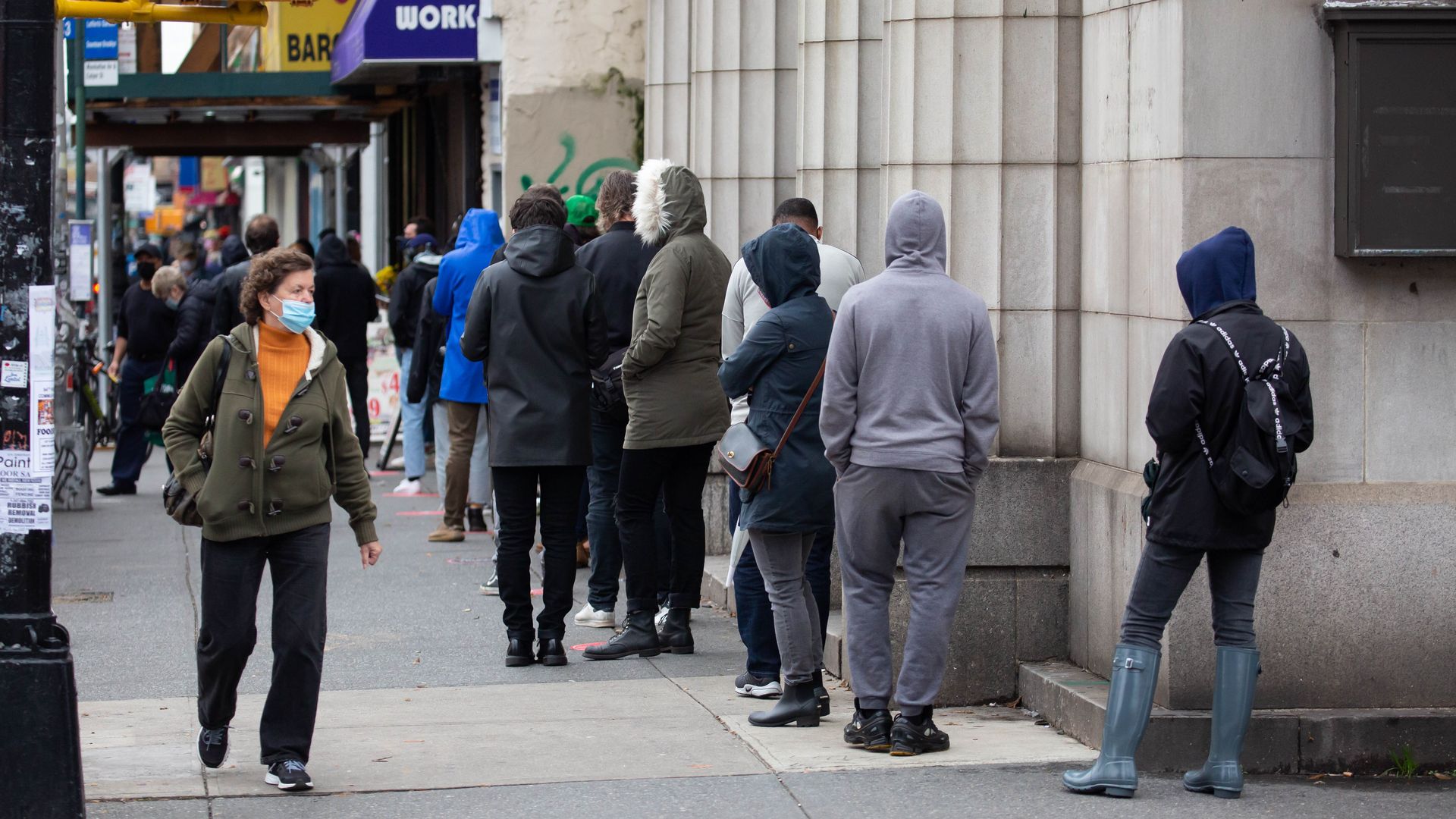 Picture of people waiting outside in line for coronavirus testing.
