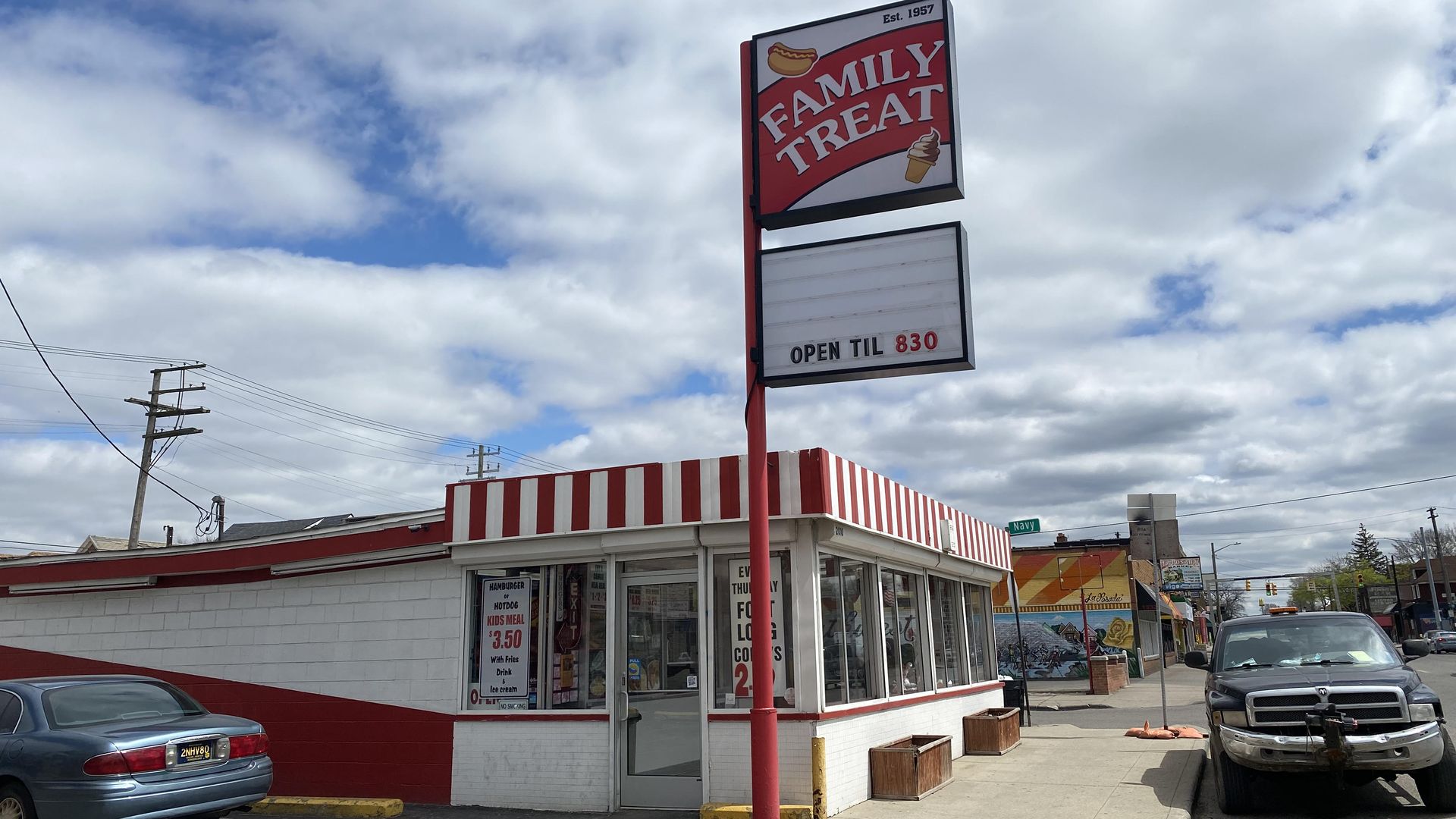 Family Treat ice cream parlor is shown with a sign that says it's open until 8:30pm.