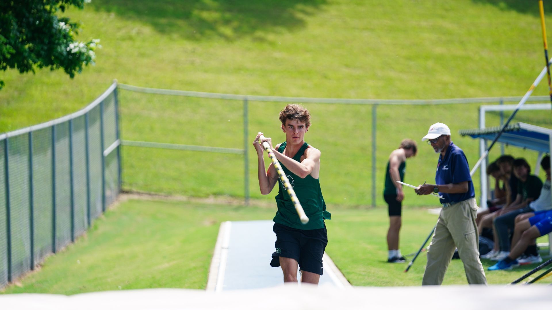 A man about to pole jump.